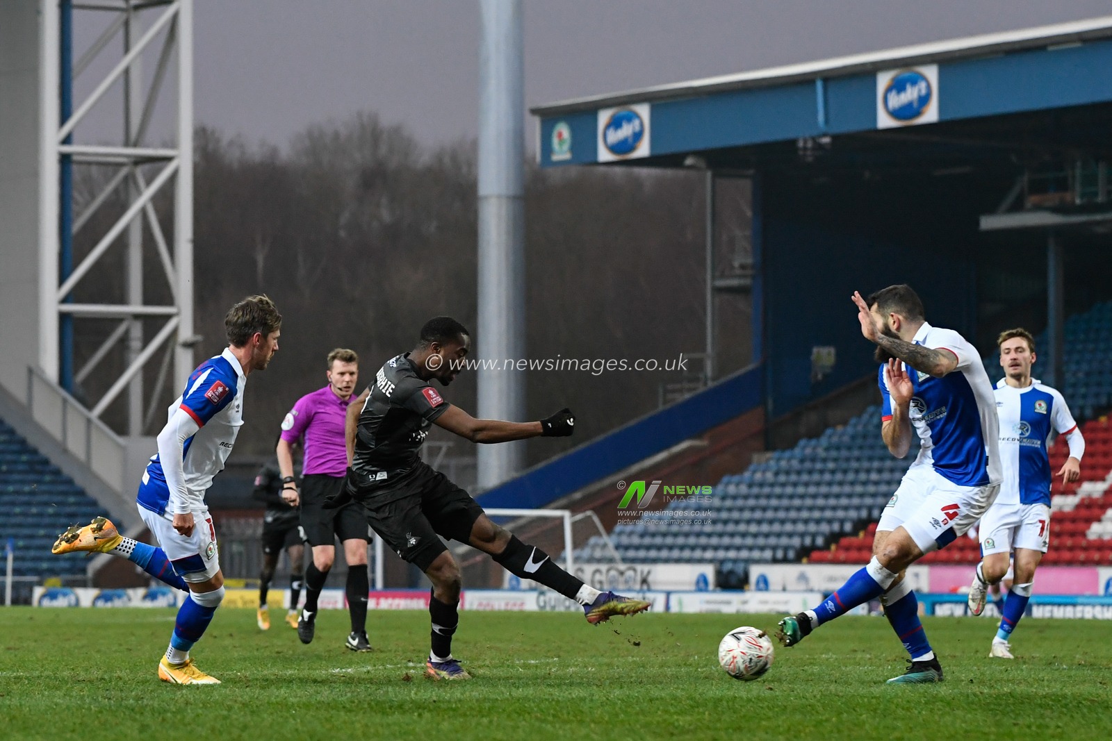 Fejiri Okenabirhie #9 of Doncaster Rovers has a shot at goal