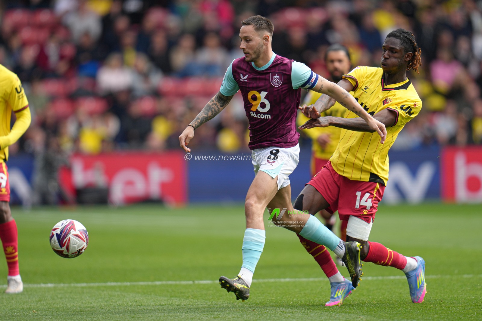 Pierre Dwomoh of Watford pushes Josh Brownhill of Burnley off the ball during the Sky Bet Championship match Watford vs Burnley at Vicarage Road, Watford, United Kingdom, 18th April 2025

(Photo by Harvey Murphy/News Images)