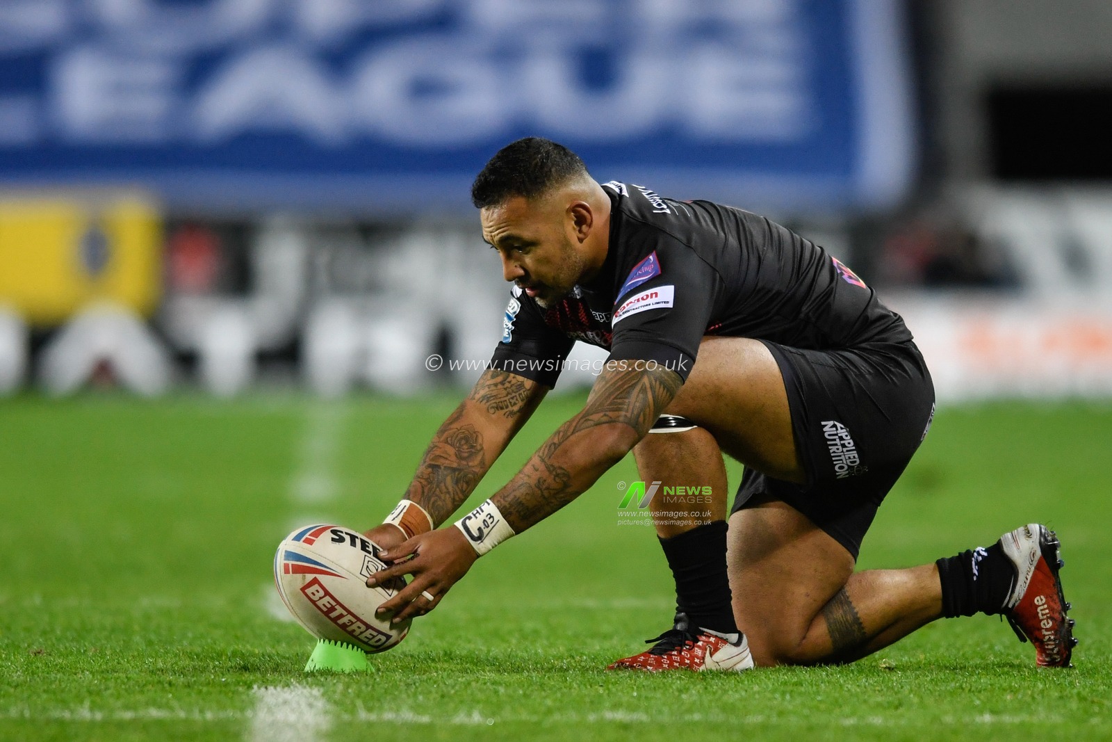 Krisnan Inu (5) of Salford Red Devils prepares to kick a conversion