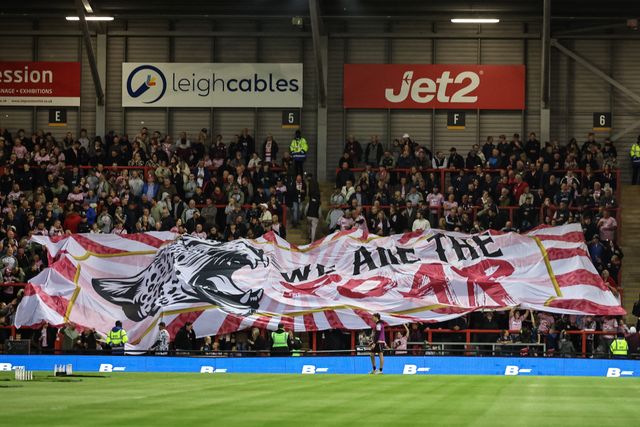 Leigh fans float a false over the home end during the Betfred Super League Round 26 match Leigh Leopards vs St Helens at Leigh Sports Village, Leigh, United Kingdom, 12th September 2025

(Photo by Mark Cosgrove/News Images)