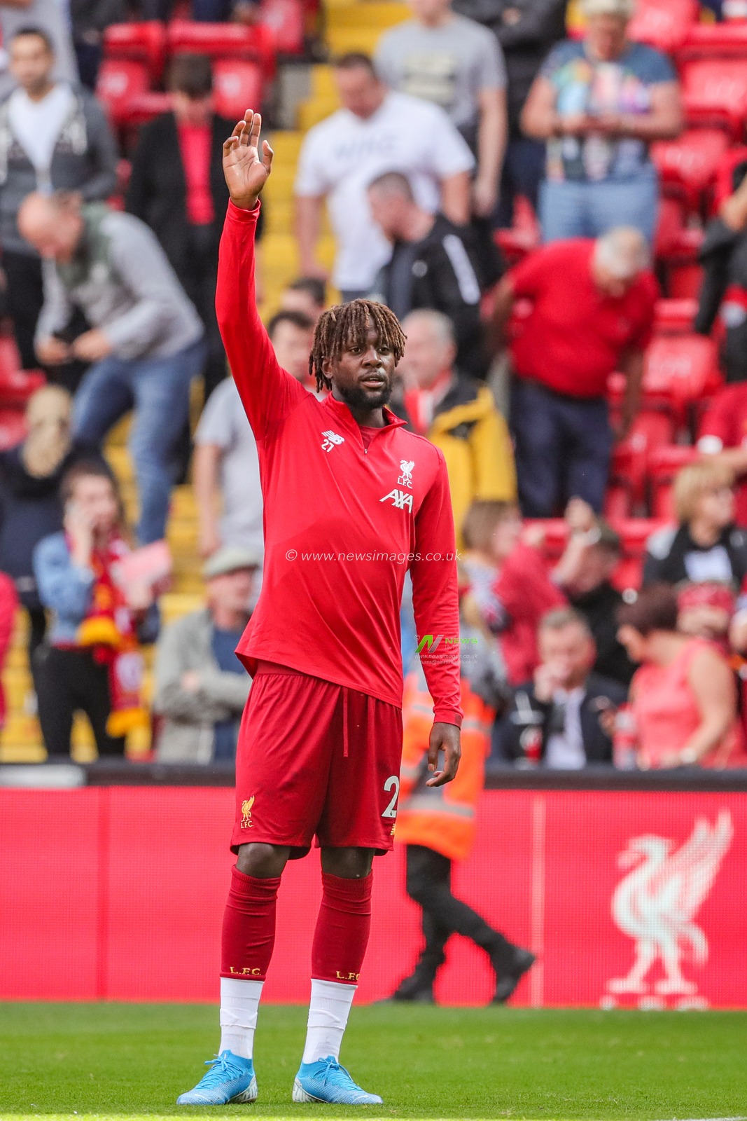 14th September 2019 , Anfield, Liverpool, England; Premier League Football, Liverpool vs Newcastle United ; Divock Origi (27) of Liverpool warming up before kick-off 


Credit: Mark Cosgrove/News Images 


Premier League/EFL Football images are subject to DataCo Licence
