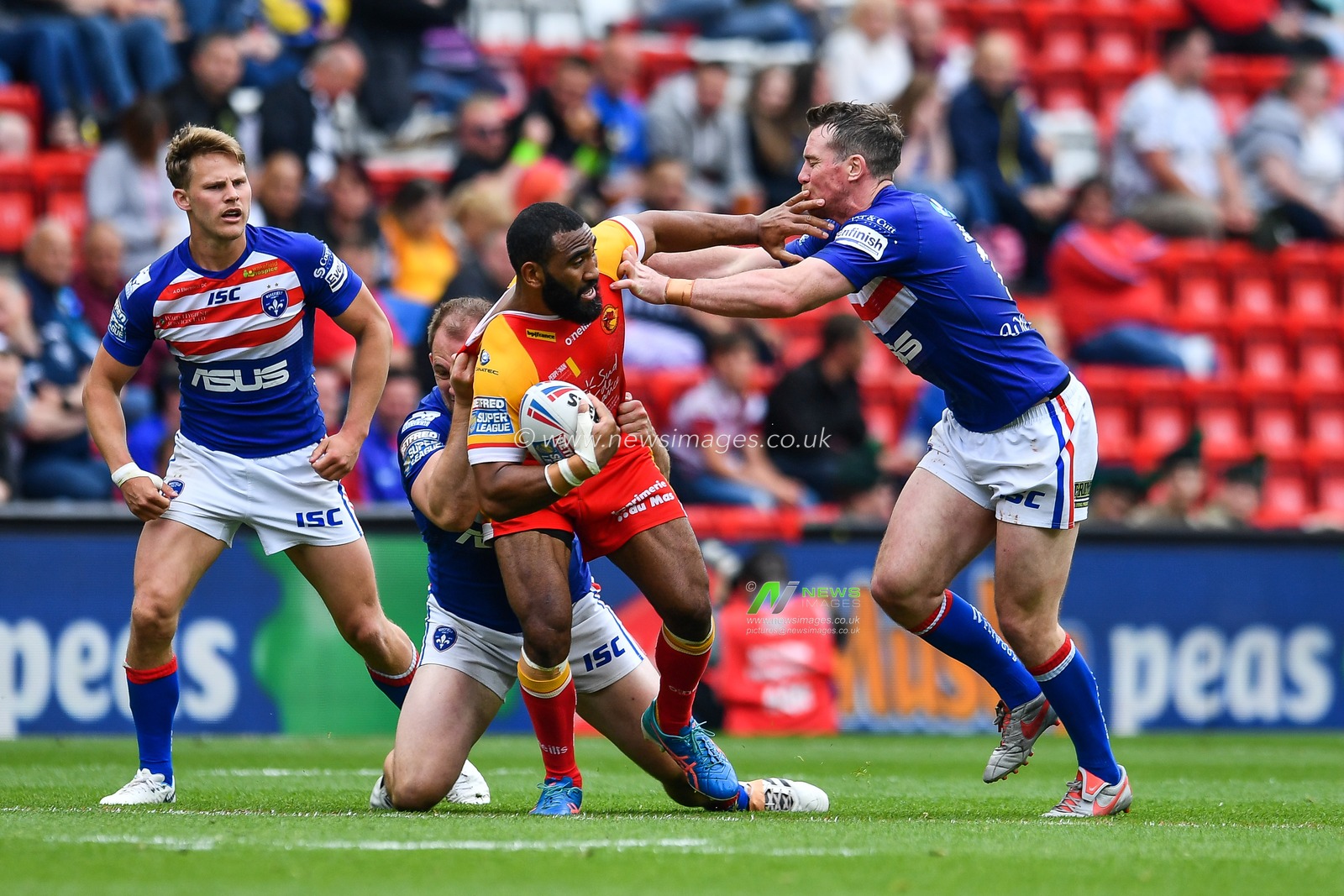 25th May 2019 , Anfield Stadium, Liverpool, England; Dacia Magic Weekend, Betfred Super League Round 16, Wakefield Trinity vs Catalans Dragons ; Samsoni Langi (6) of Catalans Dragons is tackled by George King (22) of Wakefield Trinity 

Credit: Craig Thomas/News Images