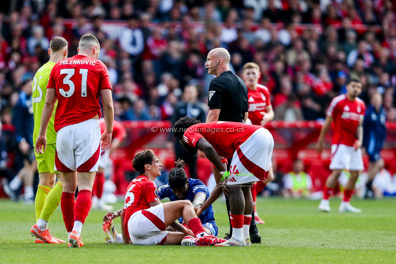 Ibrahim Sangare of Nottingham Forest and Noni Madueke of Chelsea go down with injury during the Premier League match Nottingham Forest vs Chelsea at City Ground, Nottingham, United Kingdom, 25th May 2025

(Photo by Izzy Poles/News Images)