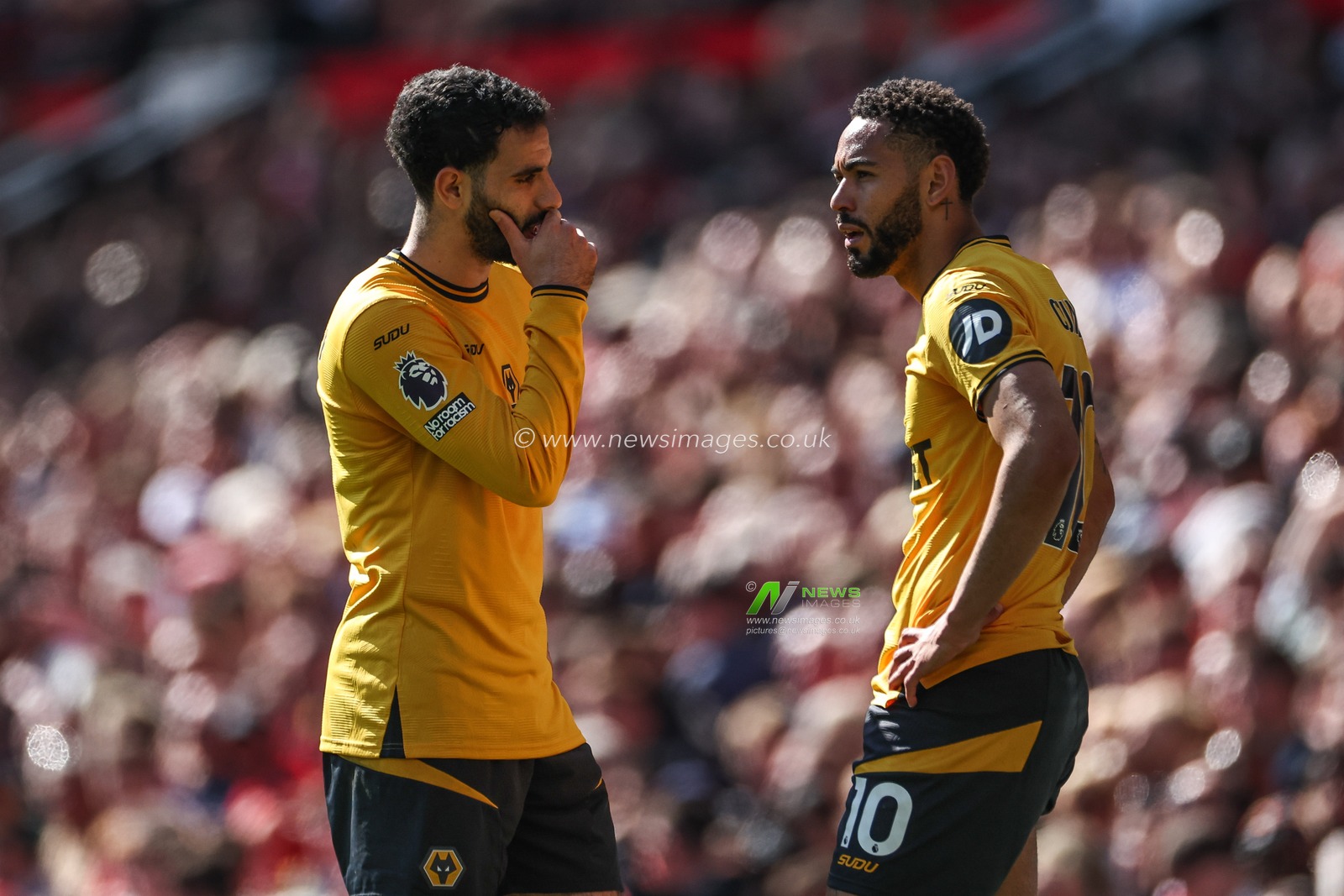 Rayan AÃ¯t-Nouri of Wolverhampton Wanderers talks to Matheus Cunha of Wolverhampton Wanderers during the Premier League match Manchester United vs Wolverhampton Wanderers at Old Trafford, Manchester, United Kingdom, 20th April 2025

(Photo by Mark Cosgrove/News Images)