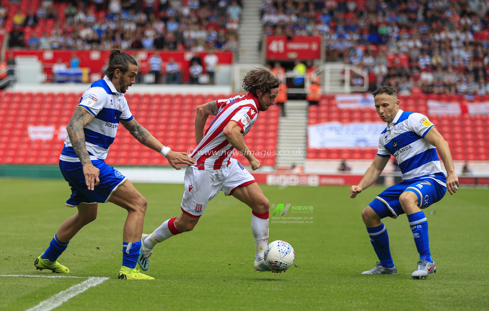 3rd August 2019, Bet365 Stadium, Stoke-on-Trent, England; Sky Bet Championship, Stoke City v Queens Park Rangers ; Joe Allen (04) of Stoke City tries to get past Marc Pugh (07) of Queens Park Rangers 

Credit: Conor Molloy/News Images

English Football League images are subject to DataCo Licence