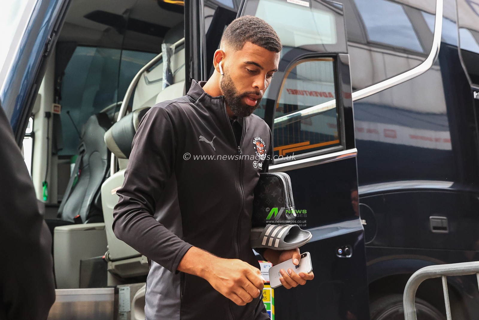 Cj Hamilton #22 of Blackpool arrives at The Den
