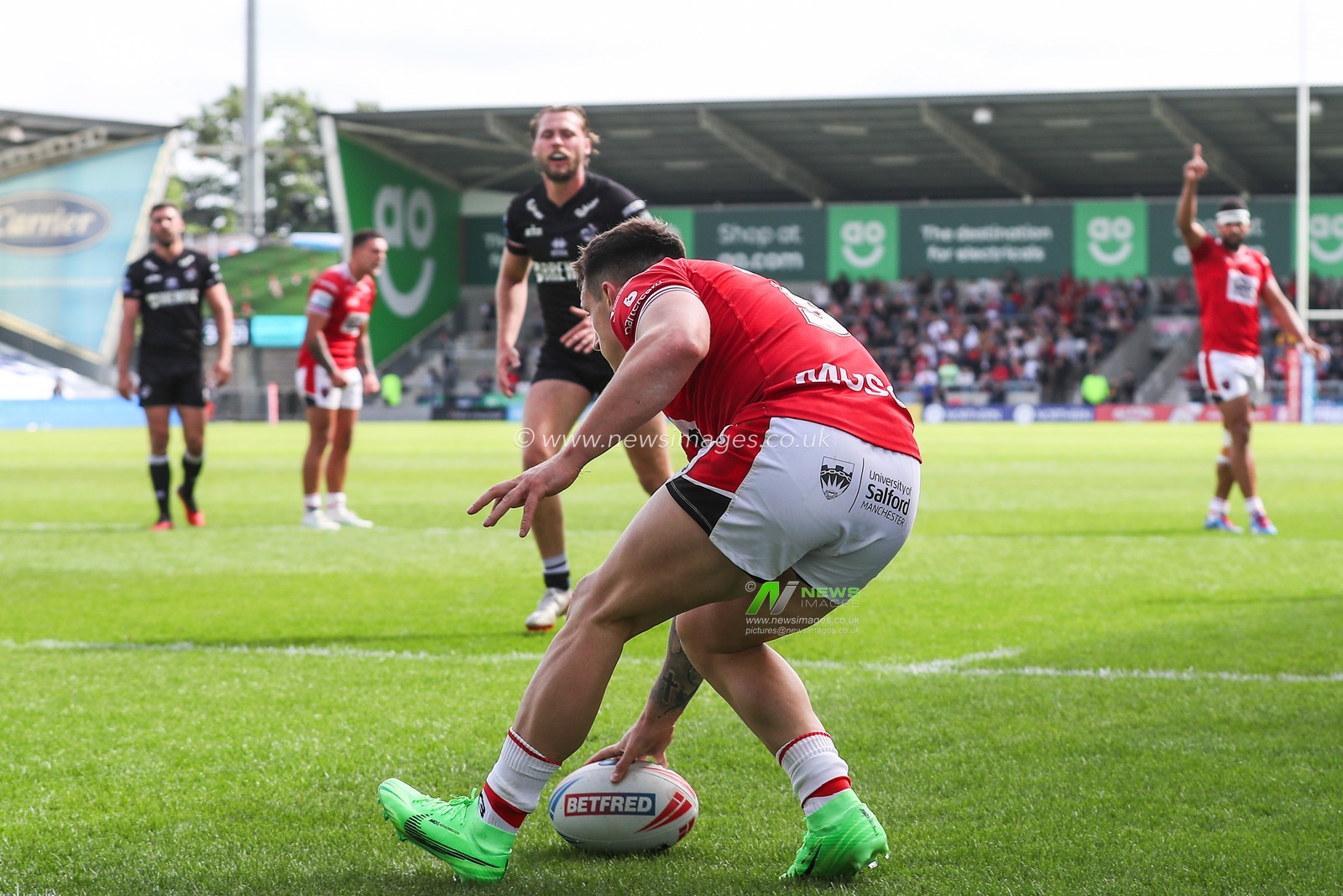 Deon Cross of Salford Red Devils goes over for a try and makes the score 10-0 during the Betfred Super League Round 13 match Salford Red Devils vs London Broncos at Salford Community Stadium, Eccles, United Kingdom, 2nd June 2024

(Photo by Gareth Evans/News Images)