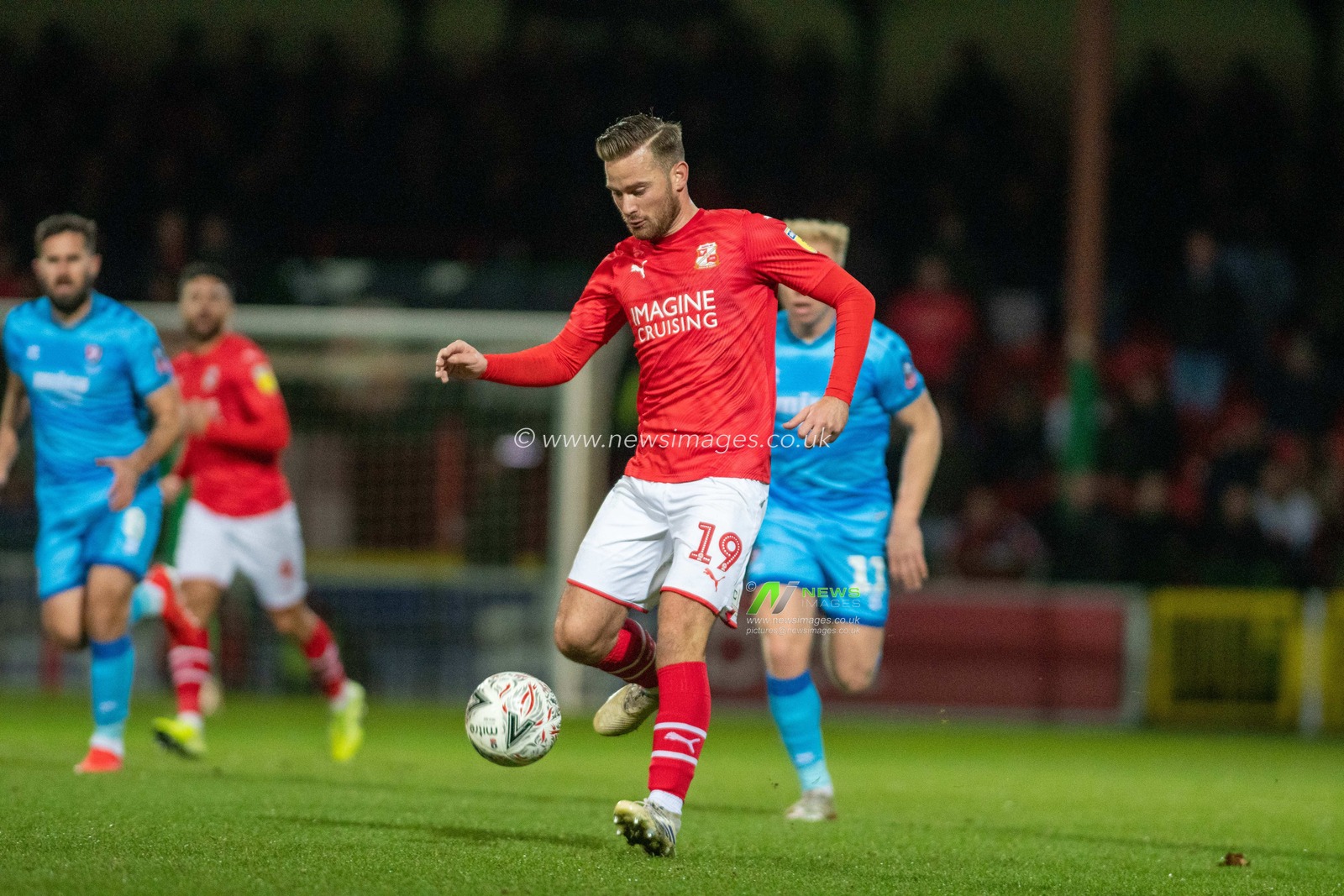 19th November 2019, County Ground, Swindon, England; Emirates FA Cup, First Round Replay, Swindon Town v Cheltenham Town : Jordan Lyden of Swindon Town passes the ball

Credit: Gareth Dalley/News Images