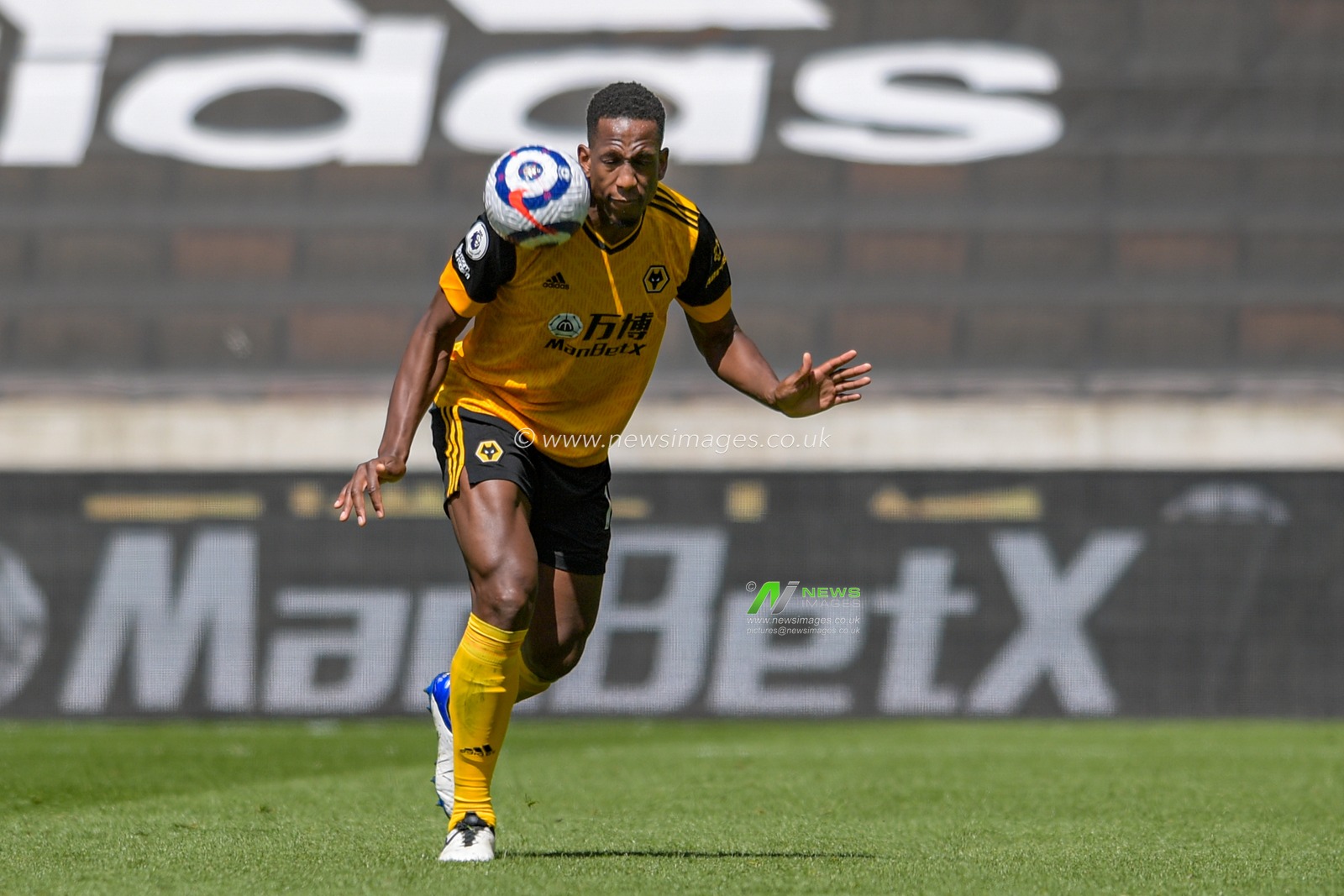 Willy Boly #15 of Wolverhampton Wanderers heads the ball