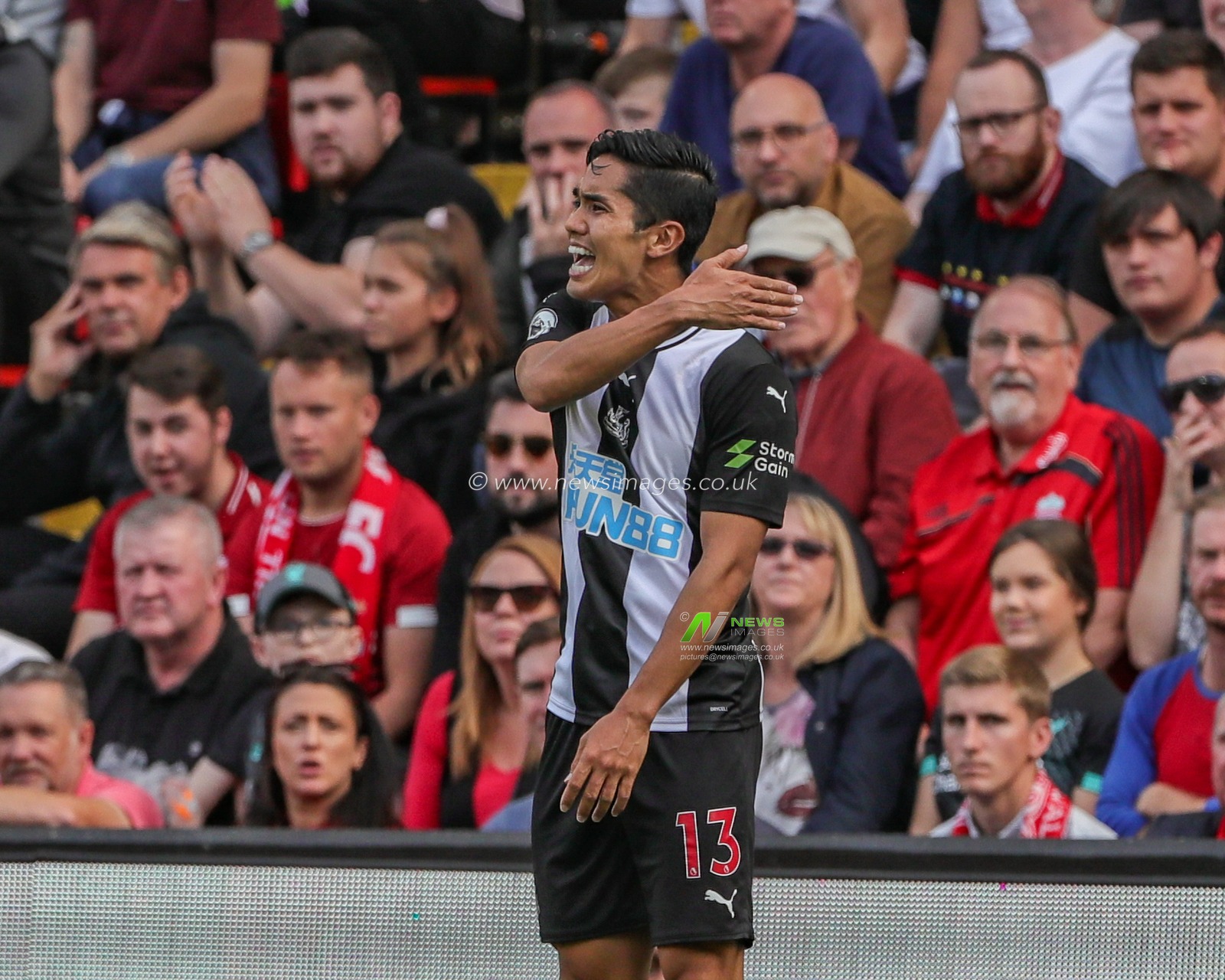14th September 2019 , Anfield, Liverpool, England; Premier League Football, Liverpool vs Newcastle United ; Yoshinori Muto (13) of Newcastle United appeals to referee Andre Marriner 


Credit: Mark Cosgrove/News Images 


Premier League/EFL Football images are subject to DataCo Licence