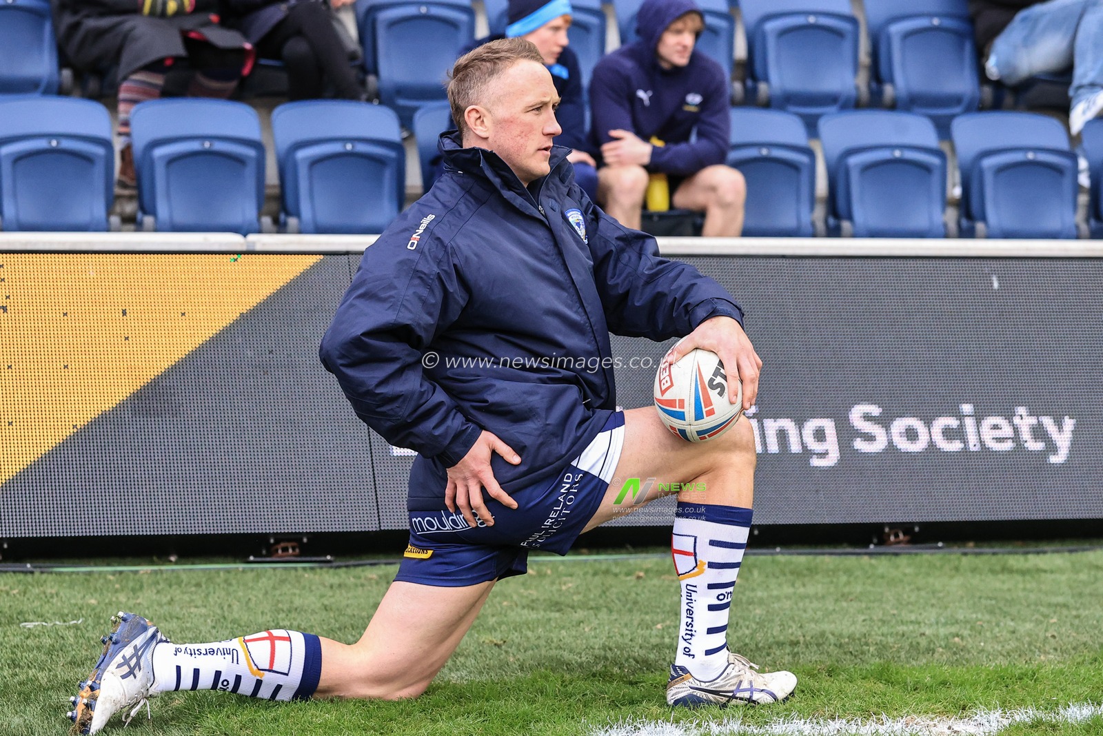 Jason Clark #14 of Warrington Wolves warming up at half time
