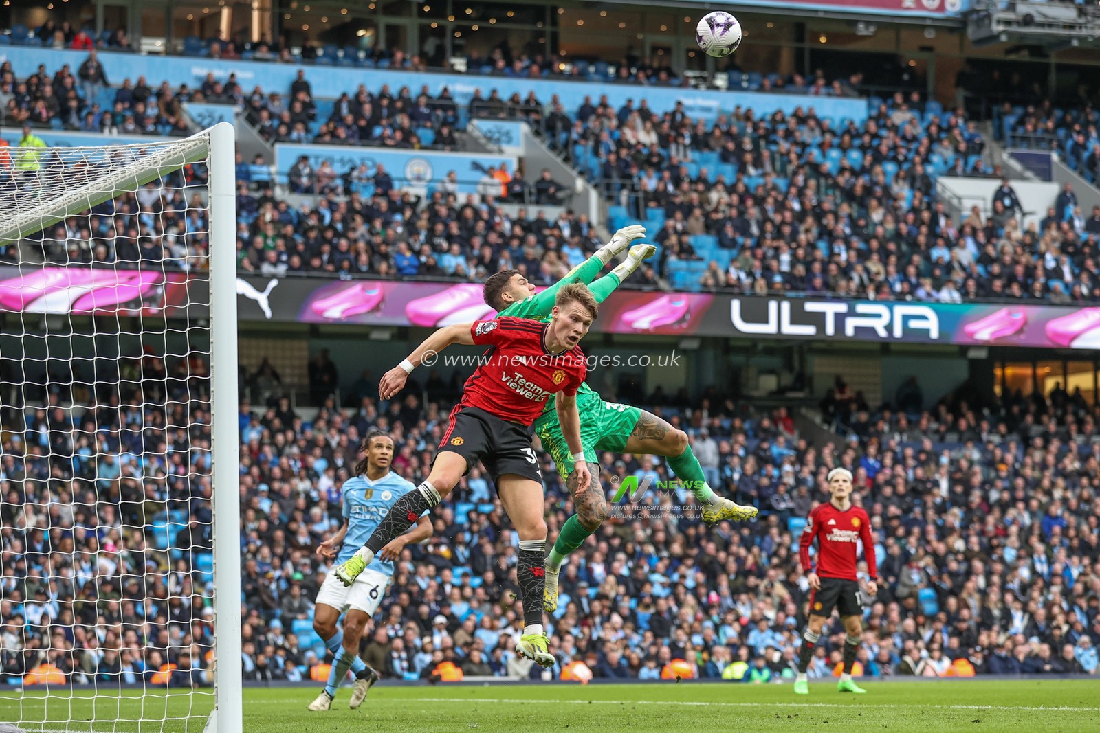 Scott McTominay of Manchester United and Ederson of Manchester City battle for the ball during the Premier League match Manchester City vs Manchester United at Etihad Stadium, Manchester, United Kingdom, 3rd March 2024

(Photo by Mark Cosgrove/News Images)