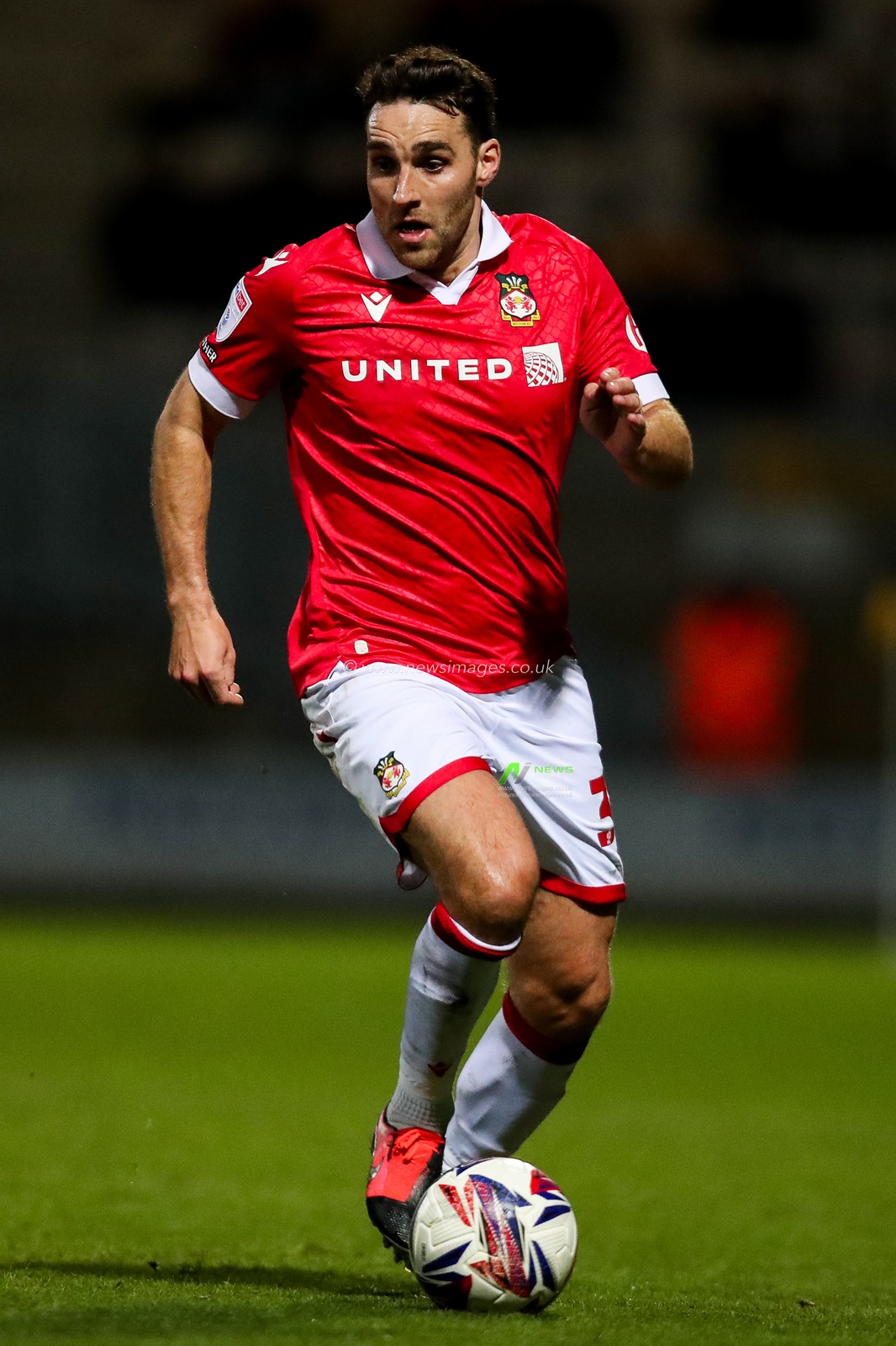 Matthew James of Wrexham AFC runs with the ball during the Sky Bet League 1 match Cambridge United vs Wrexham at Abbey Stadium, Cambridge, United Kingdom, 1st April 2025

(Photo by Izzy Poles/News Images)