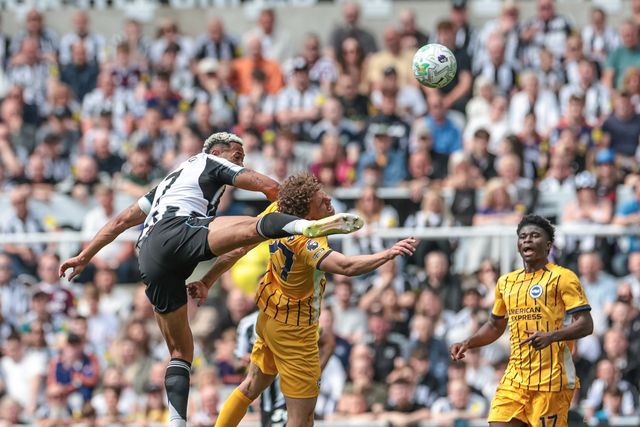 Dan Burn of Newcastle United jumps up to win the high ball from Mats Wieffer of Brighton & Hove Albion during the Premier League match Newcastle Untied vs Brighton & Hove Albion at St. James's Park, Newcastle, United Kingdom on 02 May 2026

(Photo by Mark Cosgrove/News Images)