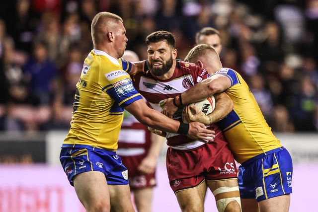 Abbas Miski of Wigan Warriors is tackled by James McDonnell of Leeds Rhinos during the Betfred Super League round 27 match Wigan Warriors vs Leeds Rhinos at The Brick Community Stadium, Wigan, United Kingdom, 19th September 2025

(Photo by Alfie Cosgrove/News Images)