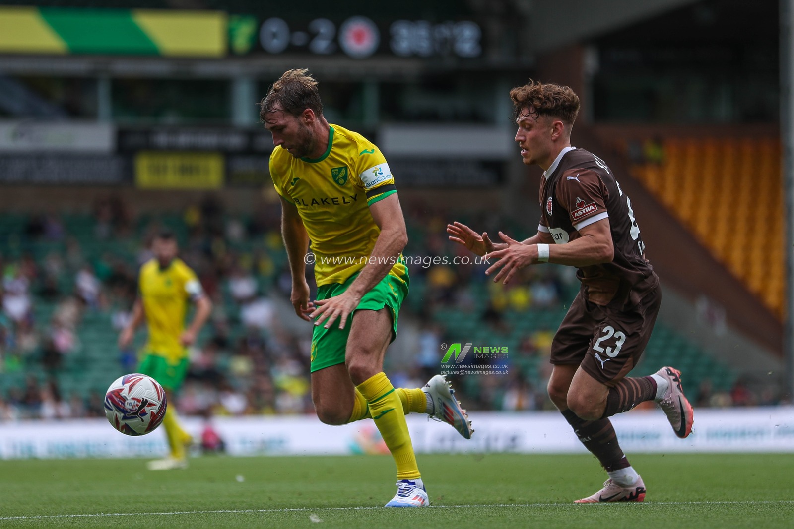 Jack Stacey of Norwich City is put under pressure by Philipp Treu of St Pauli during the Pre-season friendly match Norwich City vs St. Pauli at Carrow Road, Norwich, United Kingdom, 3rd August 2024

(Photo by Izzy Poles/News Images)