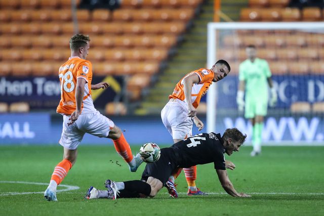 Oliver Casey of Blackpool tackles Michael Smith of Sheffield Wednesday during the Carabao Cup match Blackpool vs Sheffield Wednesday at Bloomfield Road, Blackpool, United Kingdom, 17th September 2024

(Photo by Gareth Evans/News Images)