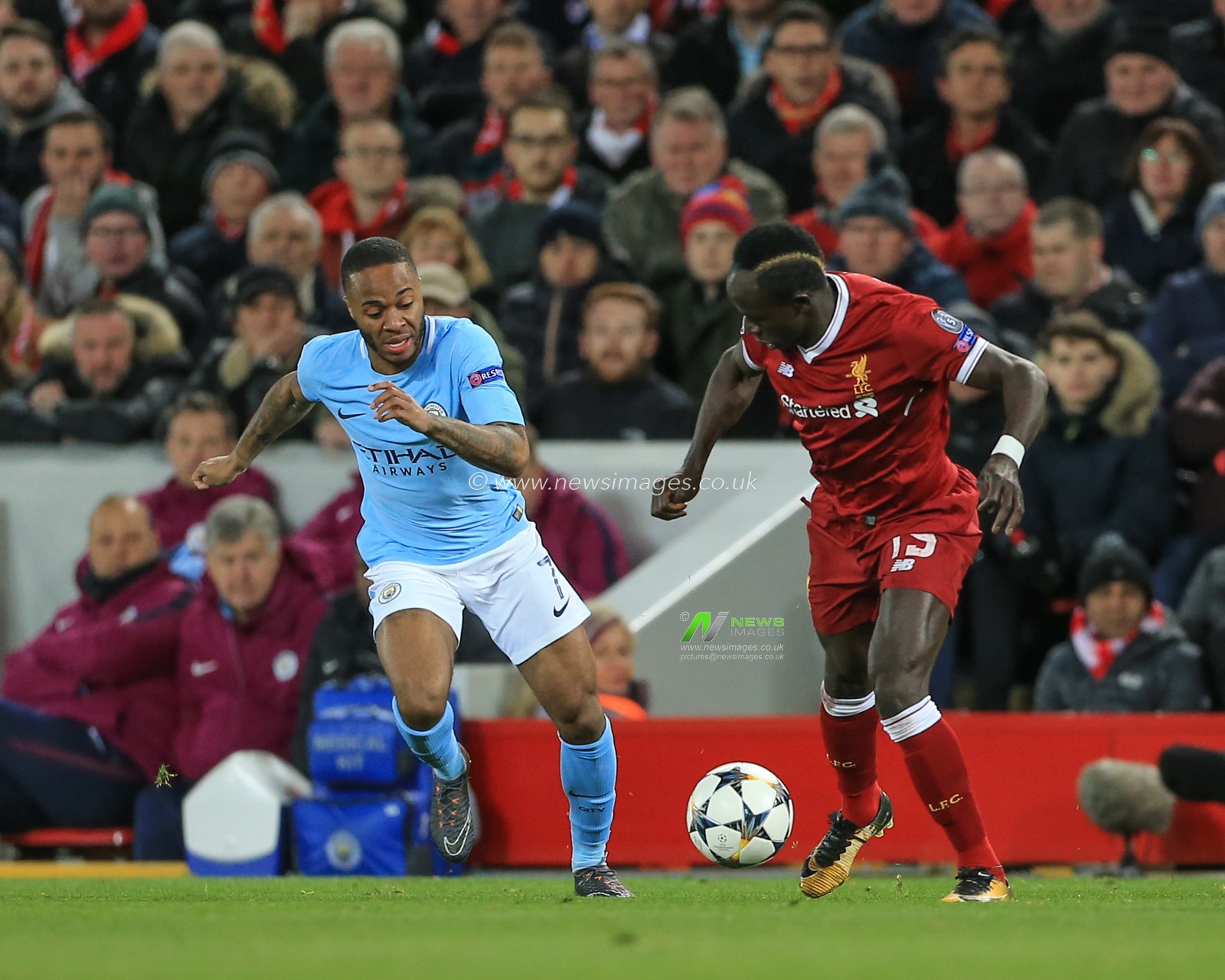4th April 2018 , Anfield, Liverpool, England; Champions League Quarter Final, first leg, Liverpool v Manchester City; Sadio Mane of Liverpool slips Raheem Sterling of Manchester City