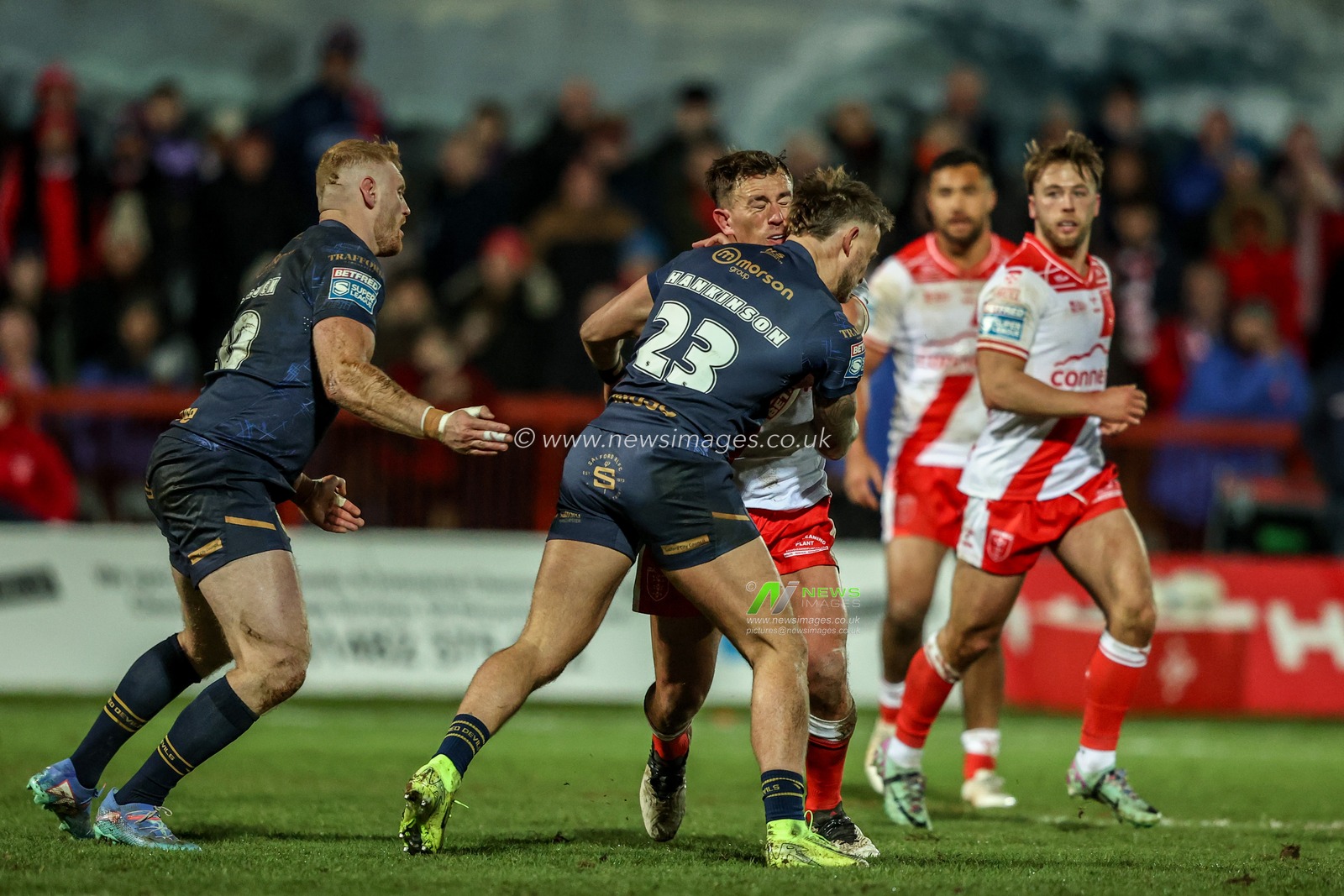 Jai Whitbread of Hull KR is tackled by Chris Hankinson of Salford Red Devils during the Betfred Super League Round 3 Hull KR vs Salford Red Devils at Sewell Group Craven Park, Kingston upon Hull, United Kingdom, 27th February 2025

(Photo by Alfie Cosgrove/News Images)