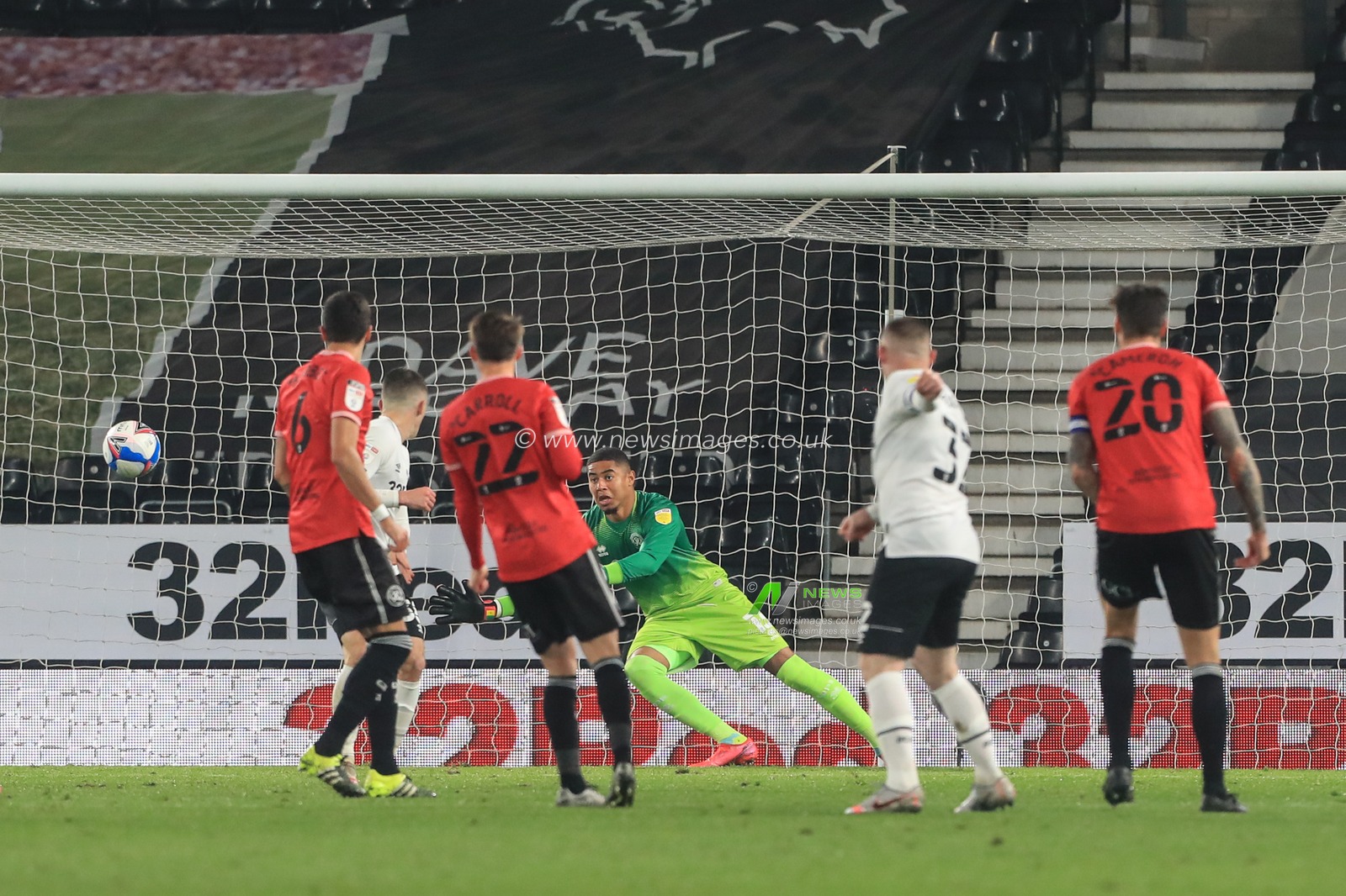 Wayne Rooney (32) of Derby County shoot goal is put out for a corner