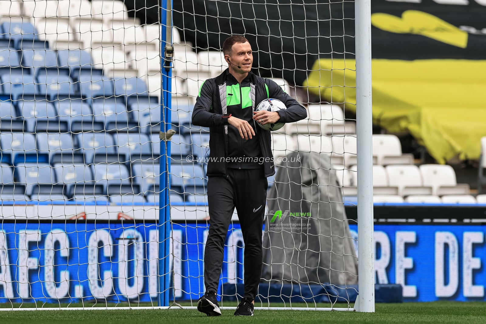Referee Leigh Doughty inspects the nets