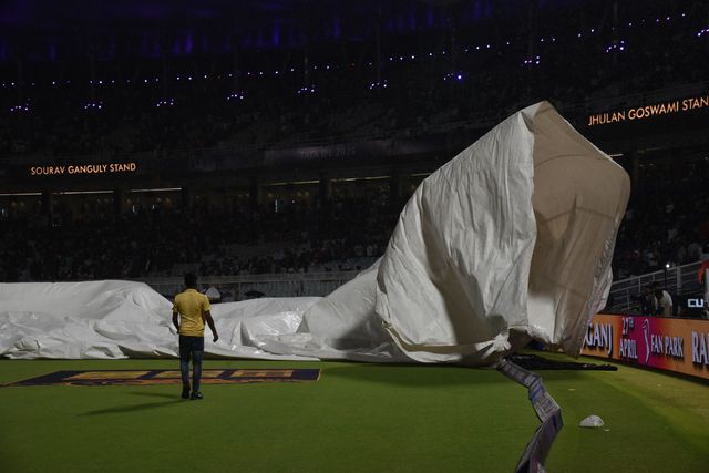 The ground staff work to keep the pitch dry as play is tries to stop the ball due to rain during the 2025 IPL match between Kolkata Knight Riders and Punjab Kings at Eden Gardens on April 26, 2025, in Kolkata, India. Photo by Debajyoti Chakraborty.(Photo: Debajyoti Chakraborty/News Images)