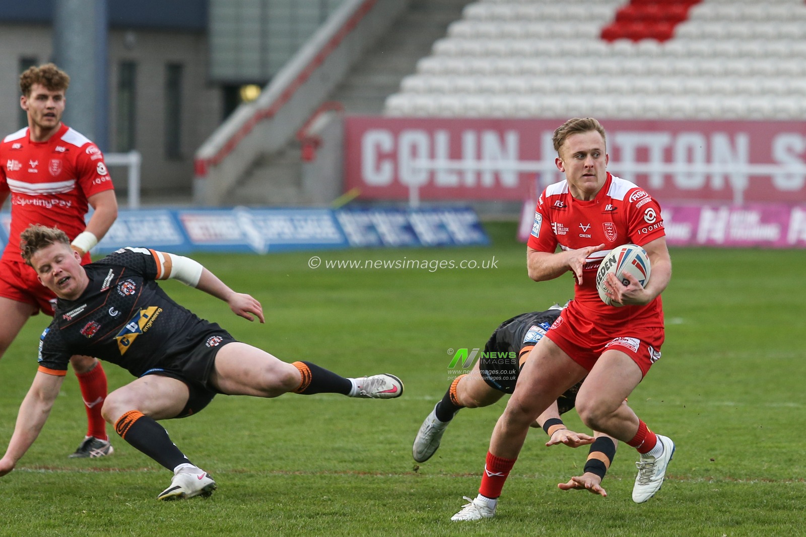 Jez Litten (14) of Hull KR runs with the ball