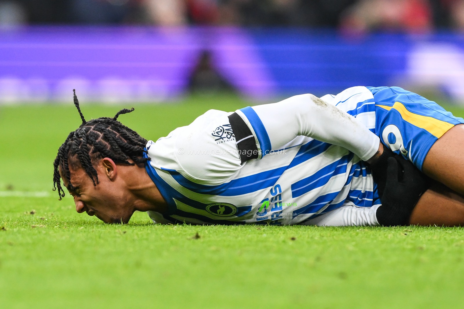 JoÃ£o Pedro of Brighton & Hove Albion face down on the pitch after being hit with the ball during the Premier League match Manchester United vs Brighton and Hove Albion at Old Trafford, Manchester, United Kingdom, 19th January 2025

(Photo by Craig Thomas/News Images)