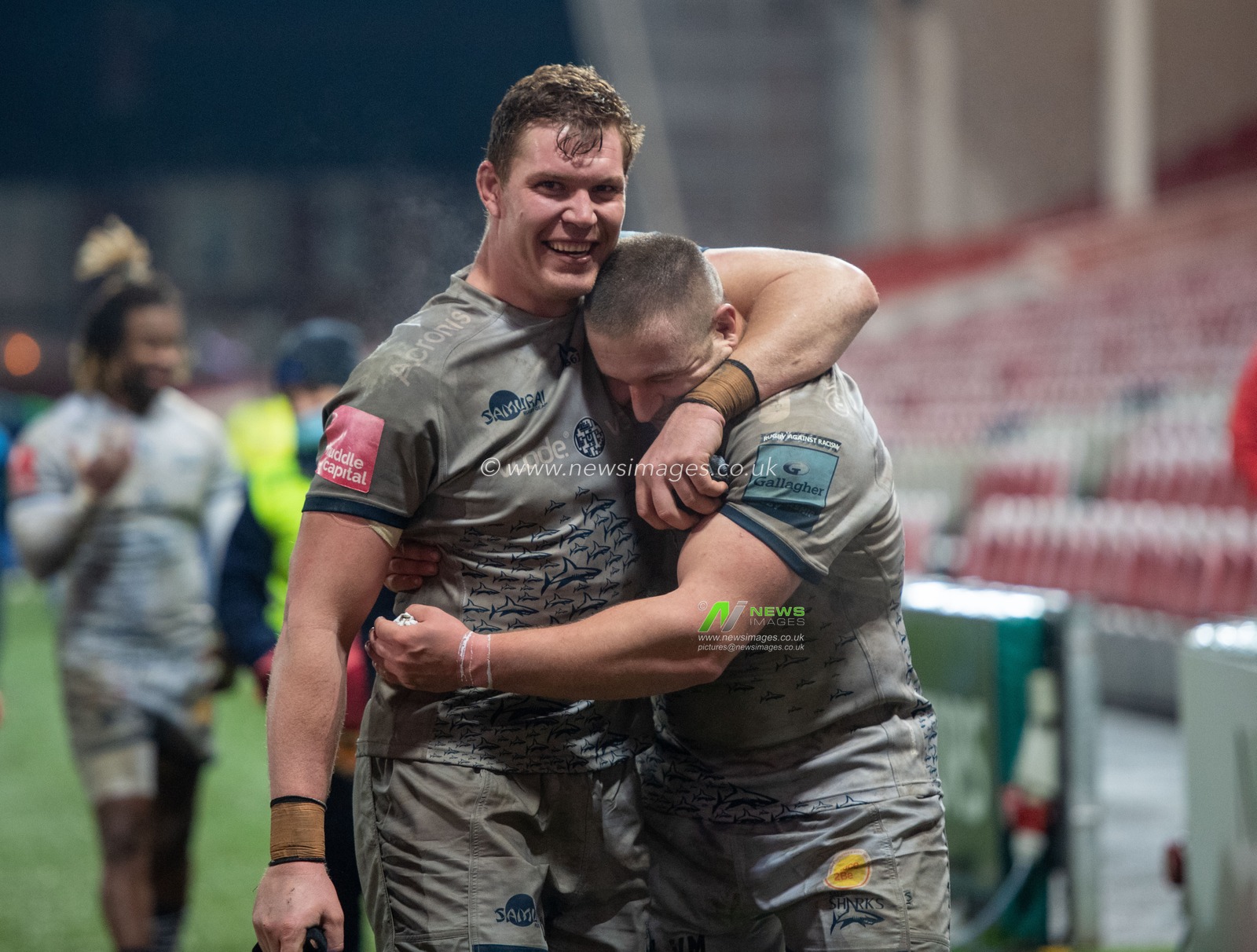 COBUS WIESE #4 of Sale Sharks and VALERY MOROZOV #17 of Sale Sharks celebrate after the final whistle.