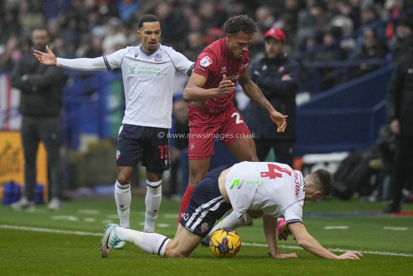 Elliot Bonds of Cheltenham Town competes for the ball with George Thomason of Bolton Wanderers during the Sky Bet League 1 match Bolton Wanderers vs Cheltenham Town at Toughsheet Community Stadium, Bolton, United Kingdom, 13th January 2024

(Photo by Steve Flynn/News Images)
