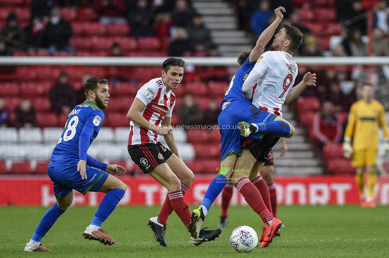 4th January 2020, Stadium Of Light, Sunderland, England; Sky Bet League 1, Sunderland v Lincoln City : Jake Hesketh (28) of Lincoln City clashes into Charlie Wyke (9) of Sunderland with his arm

Credit: Iam Burn/News Images