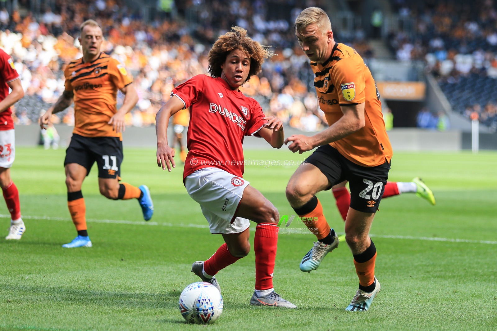 24th August 2019 , KCOM Stadium, Hull , England; Sky Bet Championship Football, Hull City vs Bristol City  ; Jarrod Bowen (20) of Hull City with the ball to get past Han-Noah Massengo

Credit:   David Greaves/News Images

English Football League images are subject to DataCo Licence