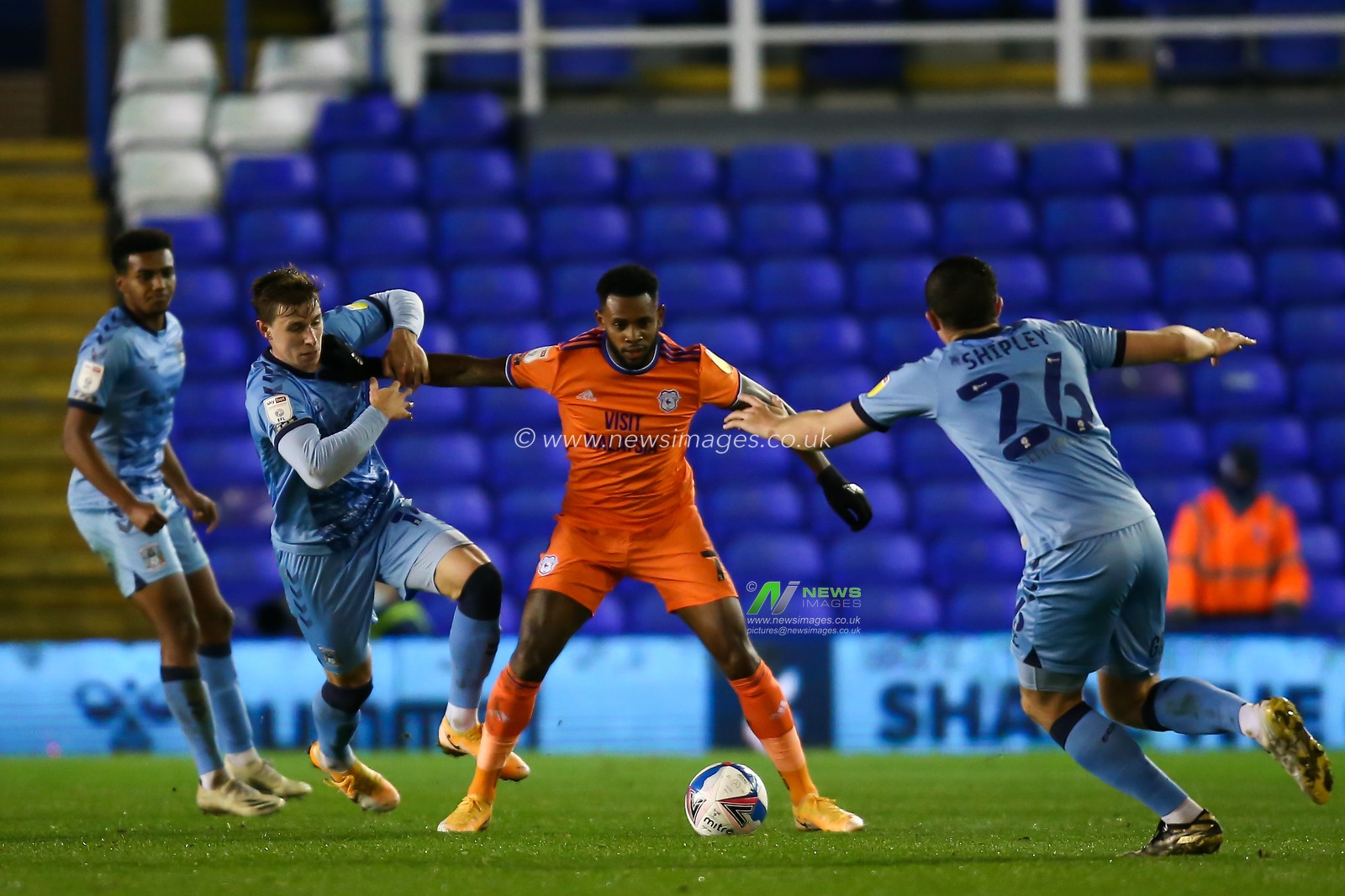Leandro Bacuna #7 of Cardiff City protects the ball from several Coventry City players