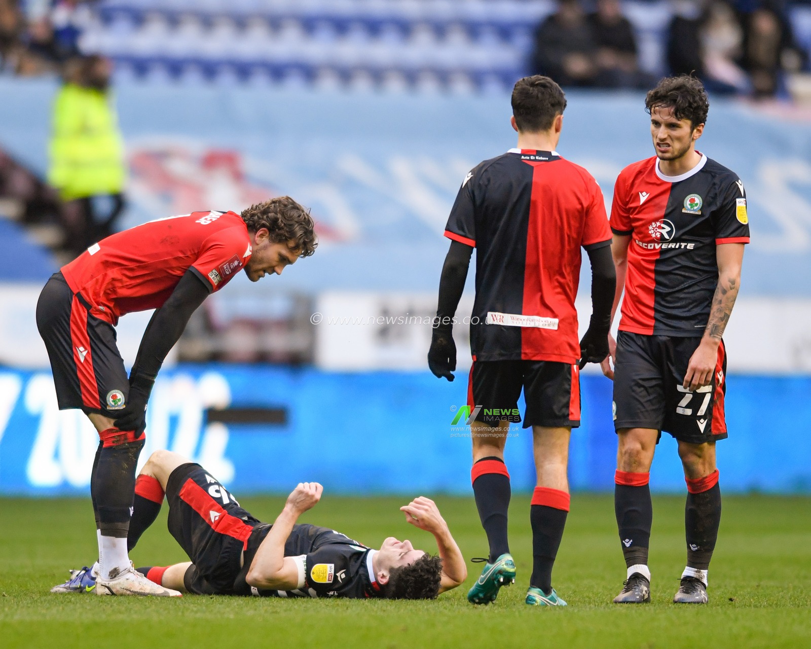 Darragh Lenihan #26 of Blackburn Rovers goes down injured on the pitch