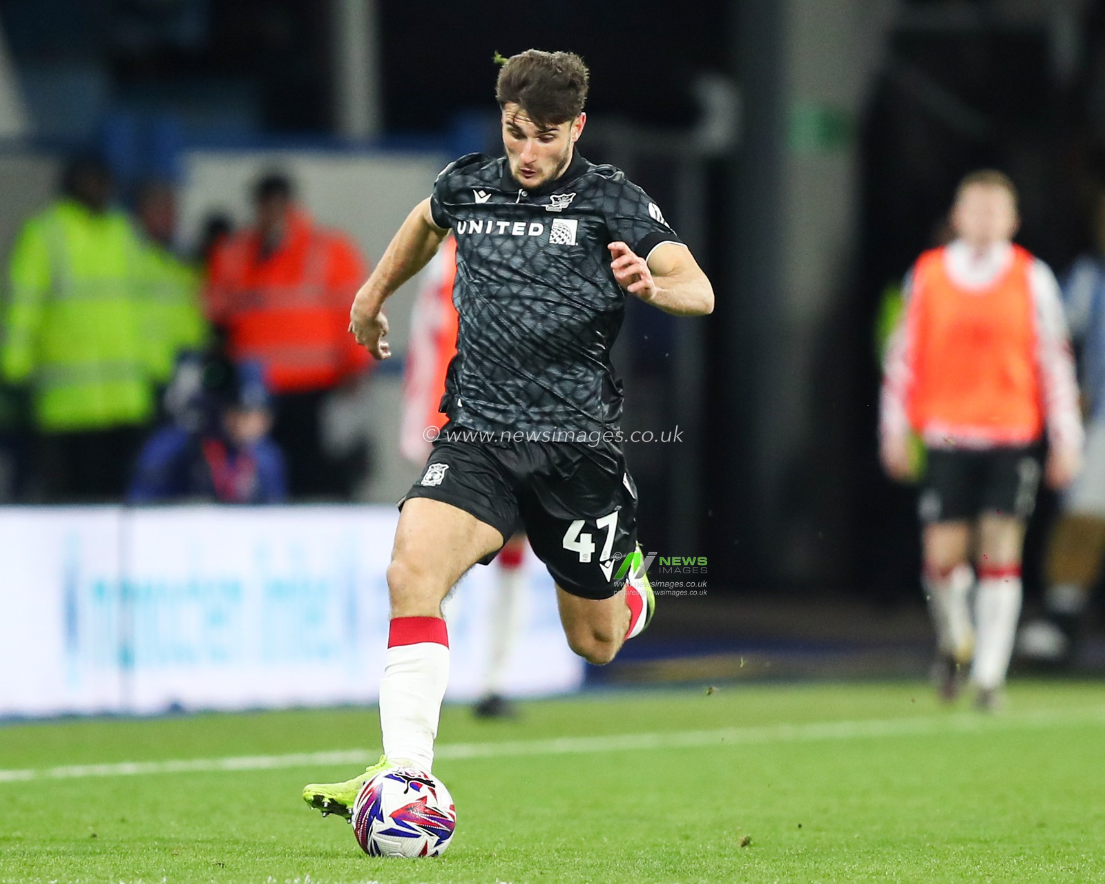 Ryan Longman of Wrexham with the ball at his feet during the Sky Bet League 1 match Huddersfield Town vs Wrexham at John Smith's Stadium, Huddersfield, United Kingdom, 4th March 2025

(Photo by Jorge Horsted/News Images)