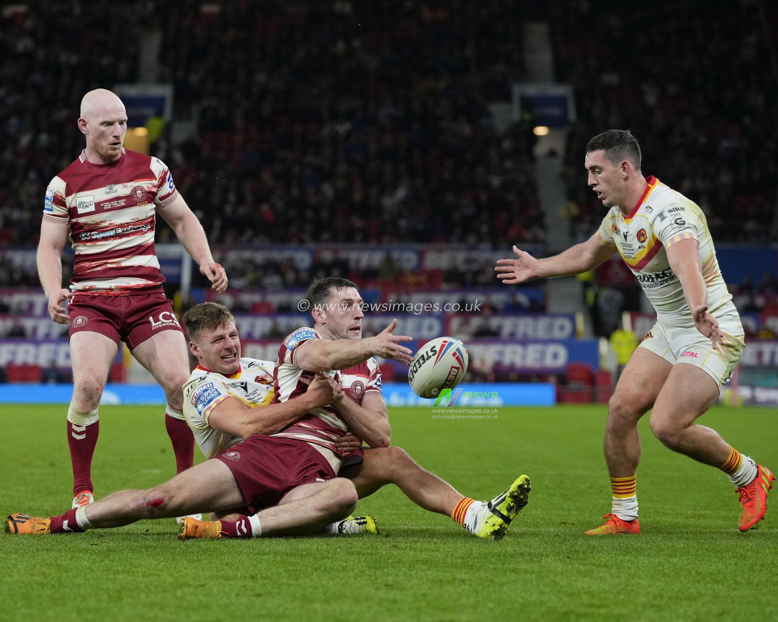 Tom Davies #2 of Catalans Dragons tackles Jake Wardle #4 of Wigan Warriors during the Betfred Super League Grand Final match Wigan Warriors vs Catalans Dragons at Old Trafford, Manchester, United Kingdom, 14th October 2023

(Photo by Steve Flynn/News Images)