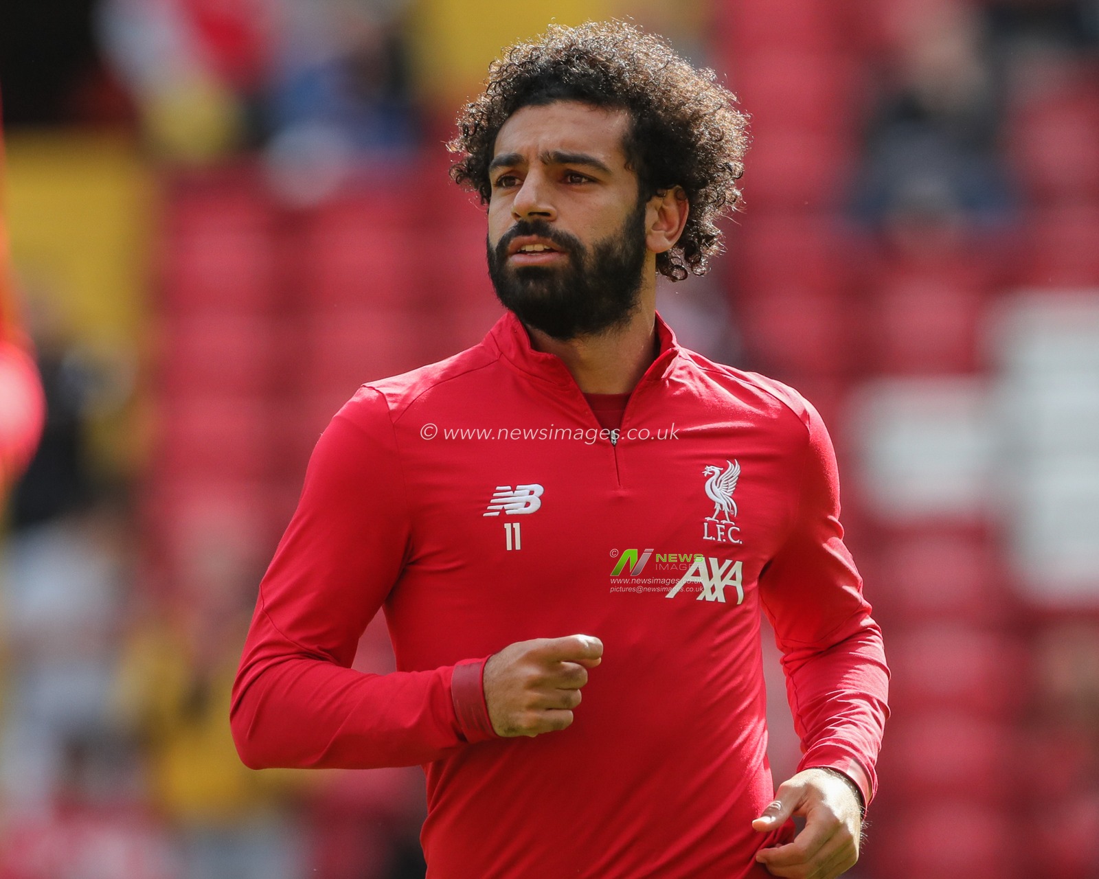 14th September 2019 , Anfield, Liverpool, England; Premier League Football, Liverpool vs Newcastle United ; Mohamed Salah (11) of Liverpool warming up before kick-off 


Credit: Mark Cosgrove/News Images 


Premier League/EFL Football images are subject to DataCo Licence