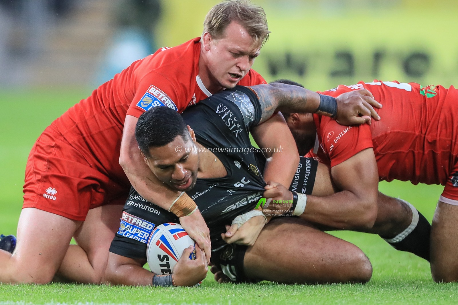 11th July 2019 , KCOM Stadium, Hull, England; Betfred Super League, Round 22, Hull FC vs London Broncos ; Mickey Paea (23) of Hull FC is tackled by Eddie Battye (8) of London Broncos 


Credit: Mark Cosgrove/News Images