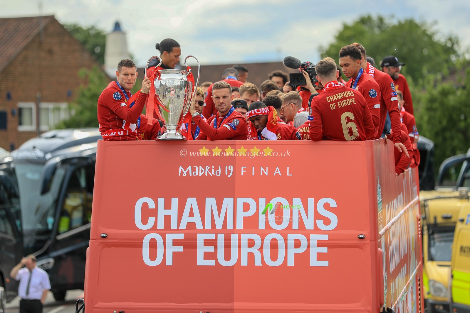 2nd June 2019 , Liverpool, England; UEFA Champions League, Liverpool FC Champions League winners celebrations and open top bus parade ; Liverpool squad on their victory parade as James Milner (07) of Liverpool and â€˜Jordan Henderson (14) of Liverpool hold the Eropean cup 


Credit: Mark Cosgrove/News Images