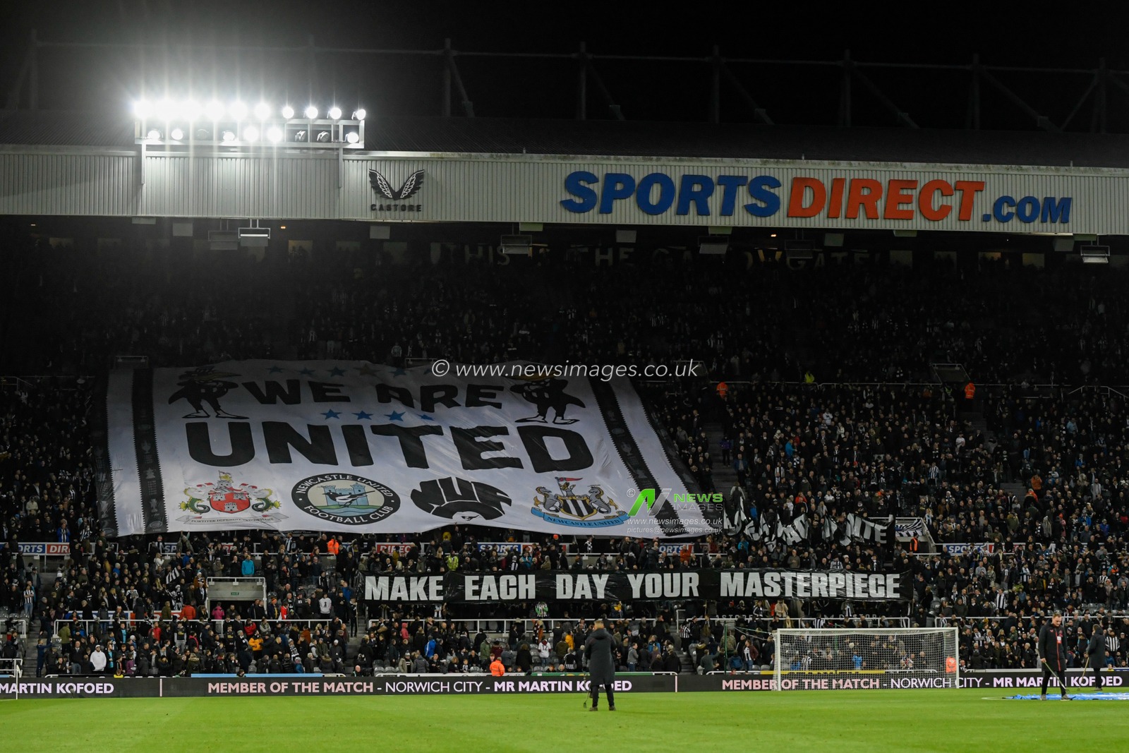 The Newcastle United fans unveil a banner before the game