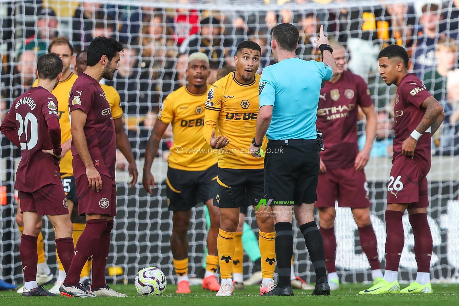 JoÃ£o Gomes of Wolverhampton Wanderers appeals to referee Chris Kavanagh during the Premier League match Wolverhampton Wanderers vs Manchester City at Molineux, Wolverhampton, United Kingdom, 20th October 2024

(Photo by Gareth Evans/News Images)