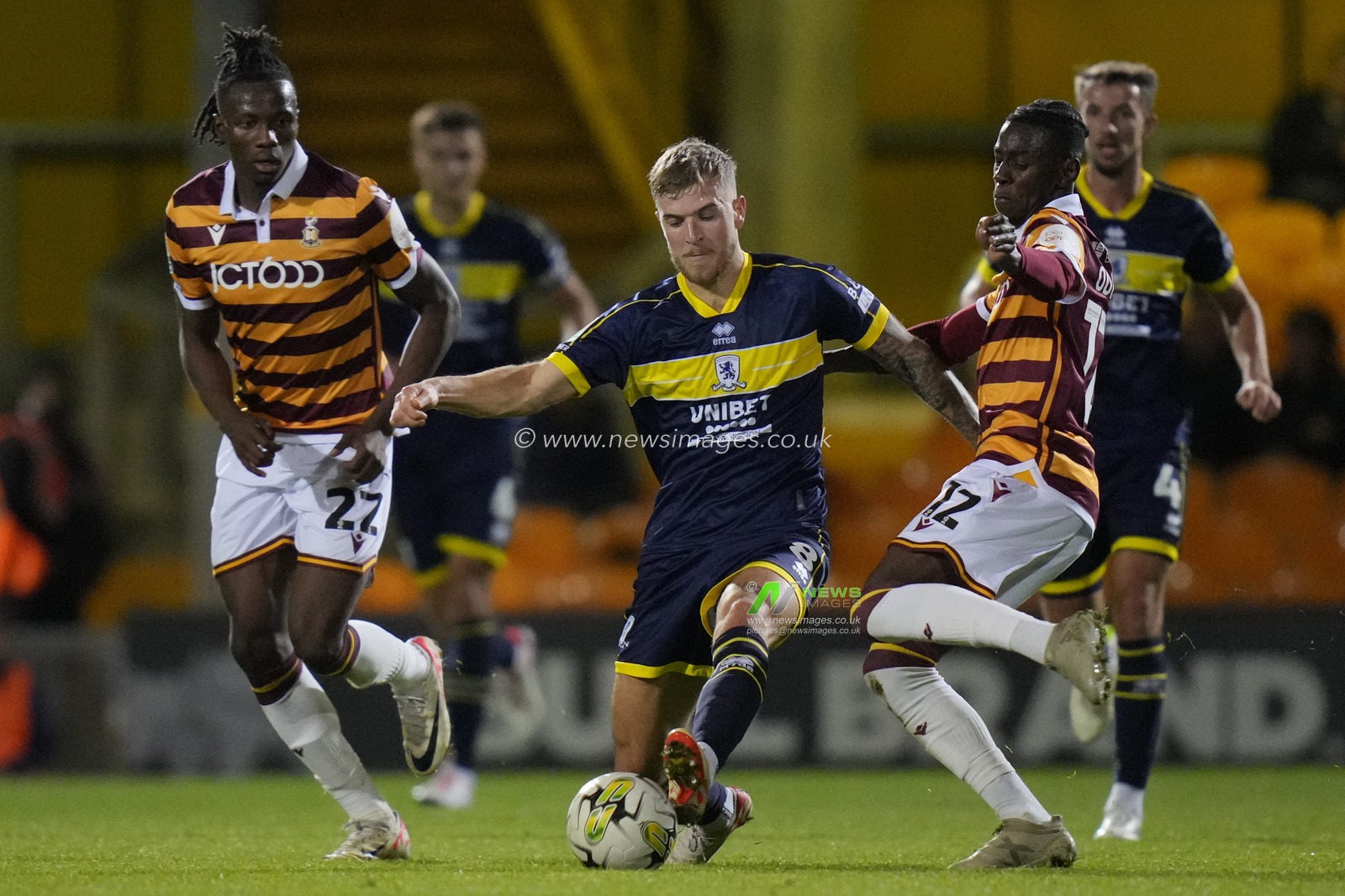 Clarke Oduor #12 of Bradford City competes for the ball with Riley McGree #8 of Middlesbrough during the Carabao Cup match Bradford City vs Middlesbrough at University of Bradford Stadium, Bradford, United Kingdom, 26th September 2023

(Photo by Steve Flynn/News Images)