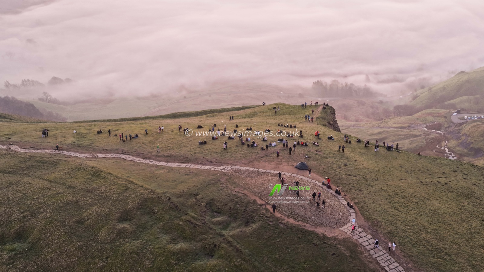 Sunrise hikers walk to the summit of Mam Tor as they watch the sunrise and admire the cloud inversion in the Hope Valley at Mam Tor in the Peak District at Mam Tor, Castleton, United Kingdom on 21 March 2026

(Photo by Mark Cosgrove/News Images)