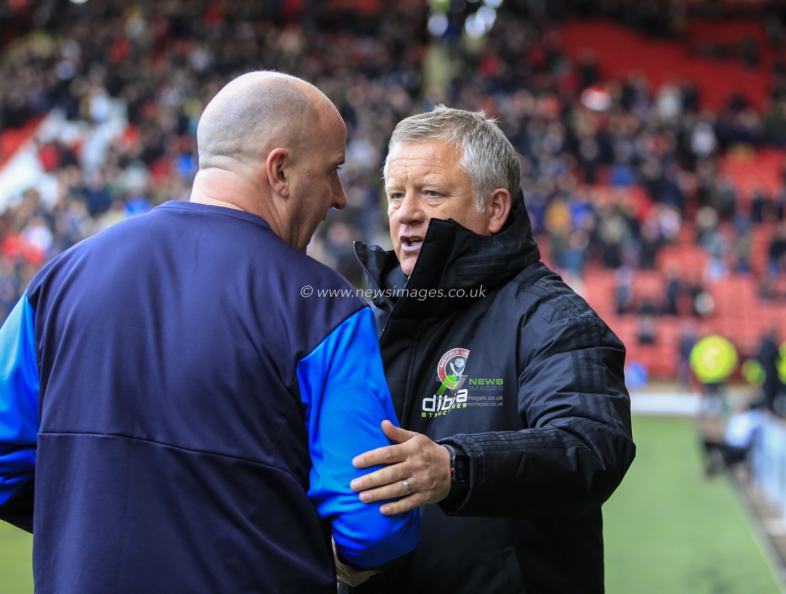 27th October 2018, Bramall Lane, Sheffield, England; Sky Bet Championship, Sheffield United v Wigan ; Sheffield United Manager Chris Wilder welcomes Wigan Athletic manager Paul Cook to the game

Credit: Conor Molloy/News Images

English Football League images are subject to DataCo Licence