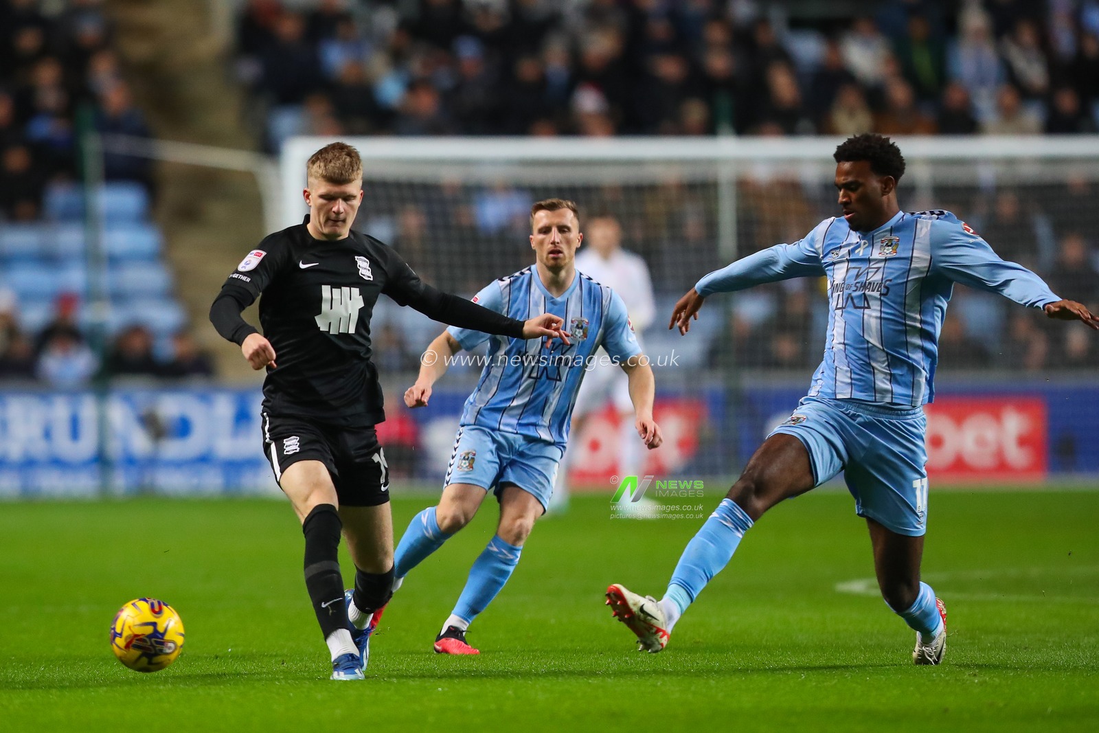 Jordan James #19 of Birmingham City is tackled by Haji Wright #11 of Coventry City during the Sky Bet Championship match Coventry City vs Birmingham City at Coventry Building Society Arena, Coventry, United Kingdom, 8th December 2023

(Photo by Gareth Evans/News Images)