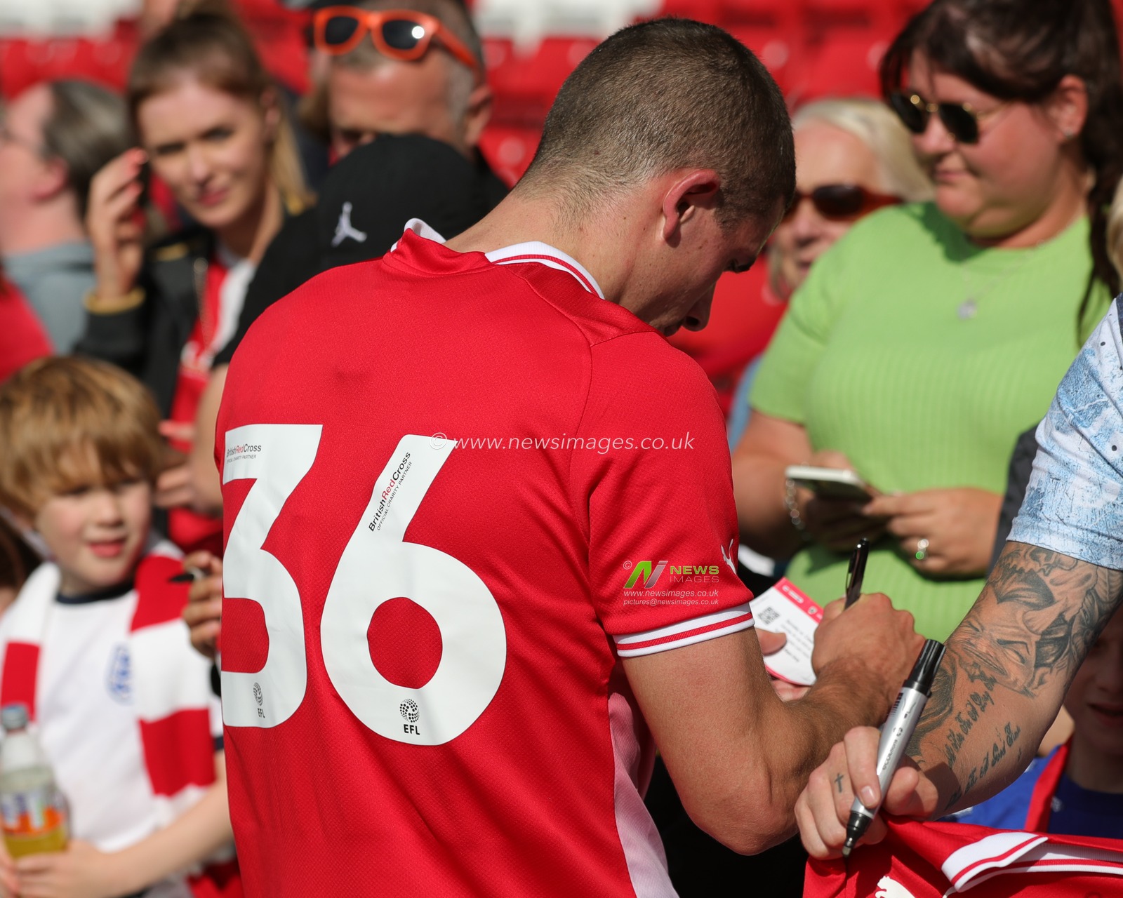 Max Watters #36 of Barnsley signing a fans ticket during the Pre-season friendly match Barnsley vs Crewe Alexandra at Oakwell, Barnsley, United Kingdom, 29th July 2023

(Photo by Alfie Cosgrove/News Images)