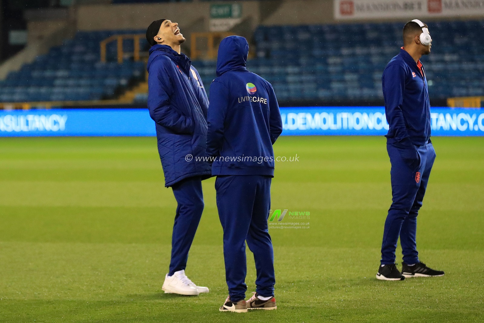 Jon Russell #37 of Huddersfield Town laughing.