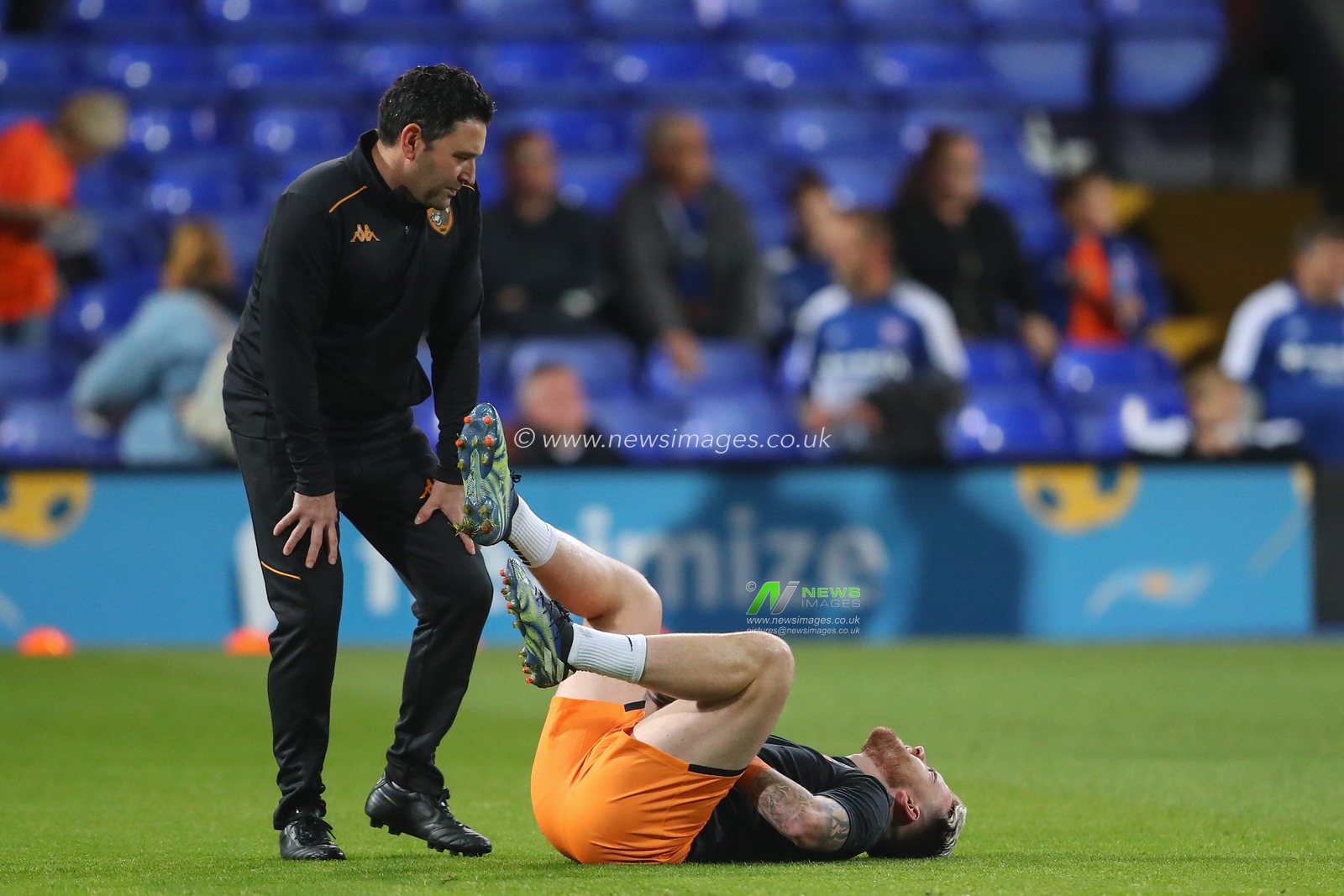 Aaron Connolly #44 of Hull City goes down injured during the pre-game warm up ahead of the Sky Bet Championship match Ipswich Town vs Hull City at Portman Road, Ipswich, United Kingdom, 3rd October 2023

(Photo by Gareth Evans/News Images)