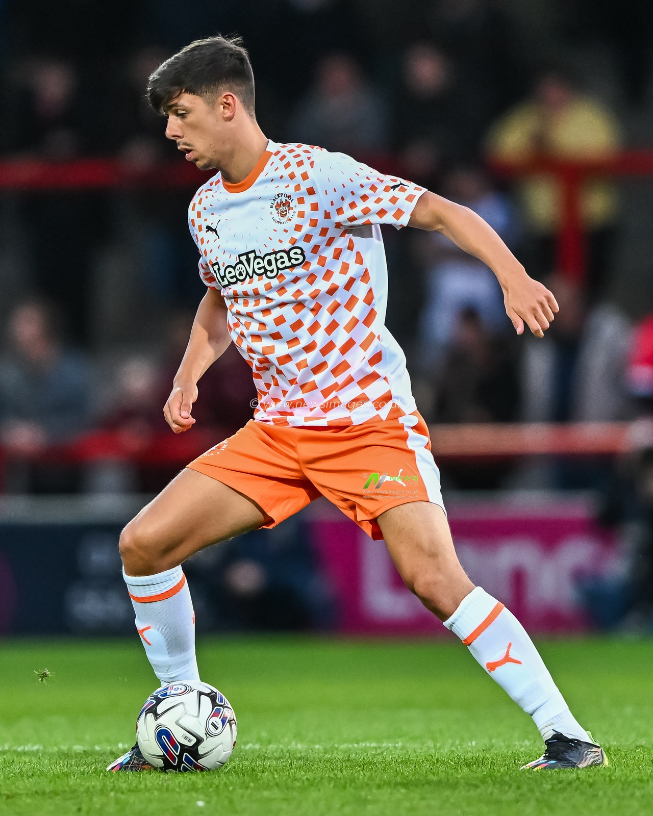 Luke Mariette #37 of Blackpool makes a break with the ball  during the Pre-season friendly match Morecambe vs Blackpool at Mazuma Stadium, Morecambe, United Kingdom, 25th July 2023

(Photo by Craig Thomas/News Images)
