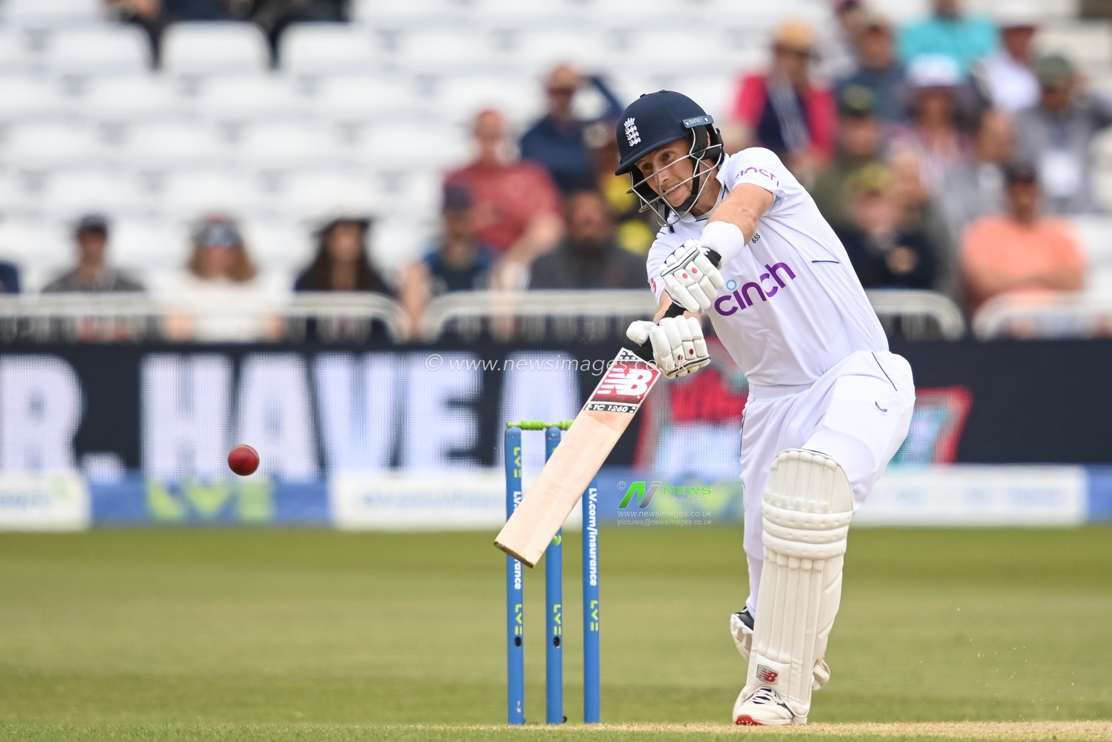 Joe Root of England drives a shot, caught by Tim Southee of New Zealand and bowled by Trent Boult of New Zealand